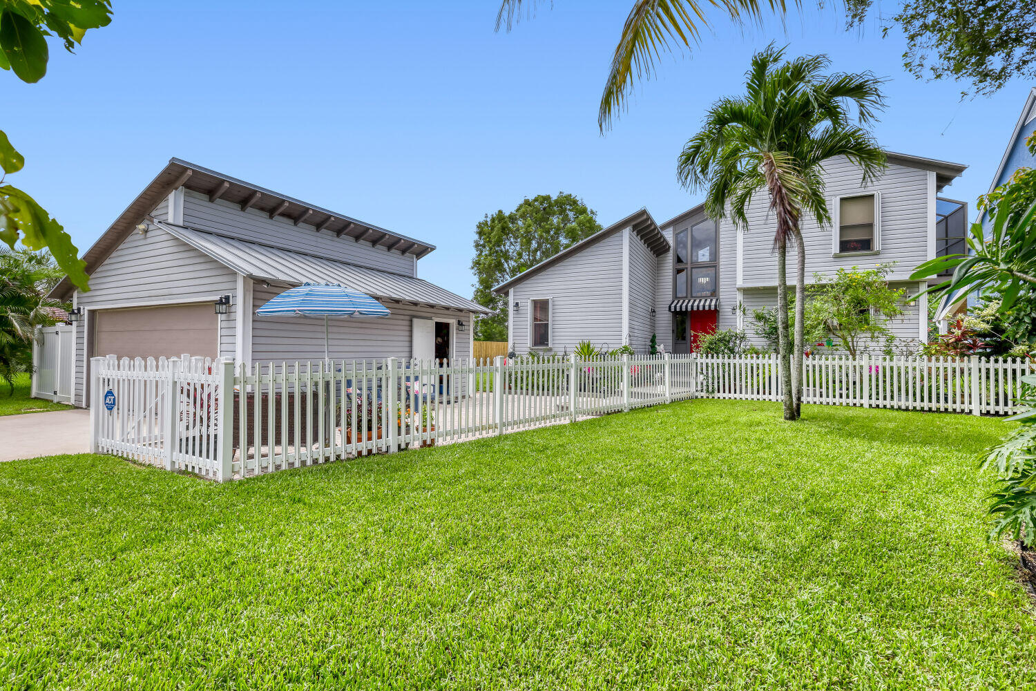 Two-Story Stylish Contemporary Single-Family Residence in West Boynton. No HOA.  Coastal Flare/Metal Roof-This Two-Story 3 Bed/2 Bath Beautifully Maintained Home must be seen. Situated on a .34 acre lushly landscaped lot along a navigable canal.  This property features a Spacious 2-car garage, Complete Impact Glass/Hurricane Shutters, Private Screened Patio and Camera Security System.  Located in a quiet neighborhood, this home combines comfortable living with unique elegant design.