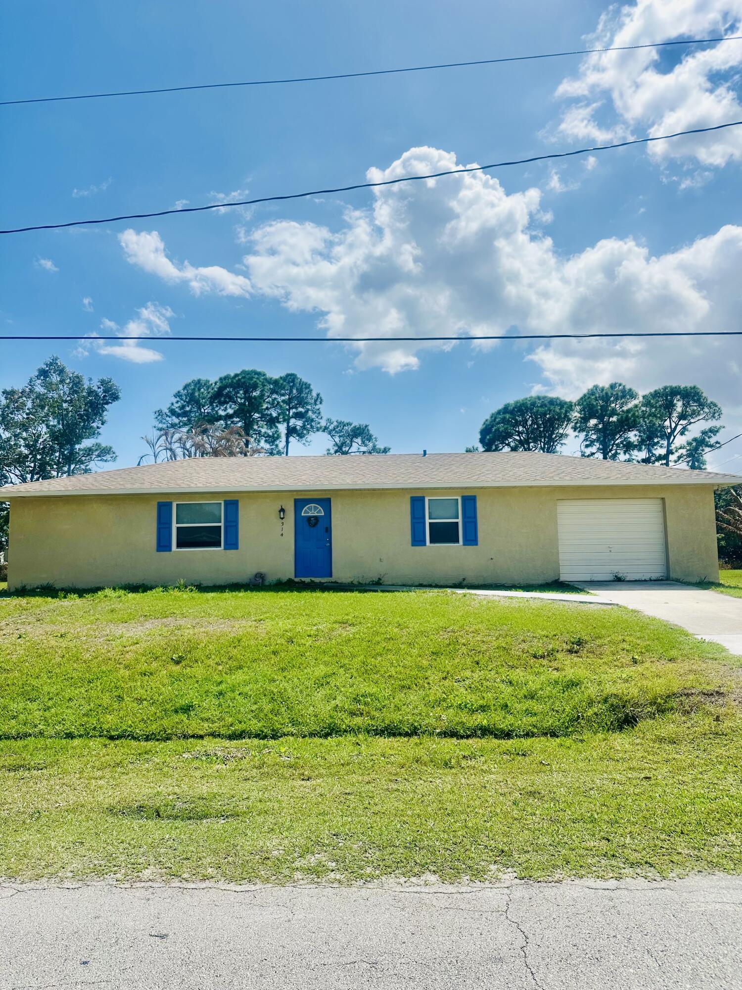 This well maintained 2 bedroom, 2 bathroom CBS home offers a desirable split-bedroom floor plan, laminate flooring throughout, and a newer roof installed in 2023. The spacious primary suite features an impressive wrap-around closet, providing excellent storage. Beautiful kitchen with stainless steel appliances large pantry. Enjoy outdoor living with a covered porch and a generously sized backyard with plenty of room to add a pool. Conveniently located just a few miles from I 95 and the Florida Turnpike, making commuting easy. Crosstown Parkway is also nearby, offering quicker access to the beach. The property backs up to a drainage right of way, creating a natural privacy buffer. Additional updates include an AC system installed in 2022 and conversion from septic to city sewer in 2020.