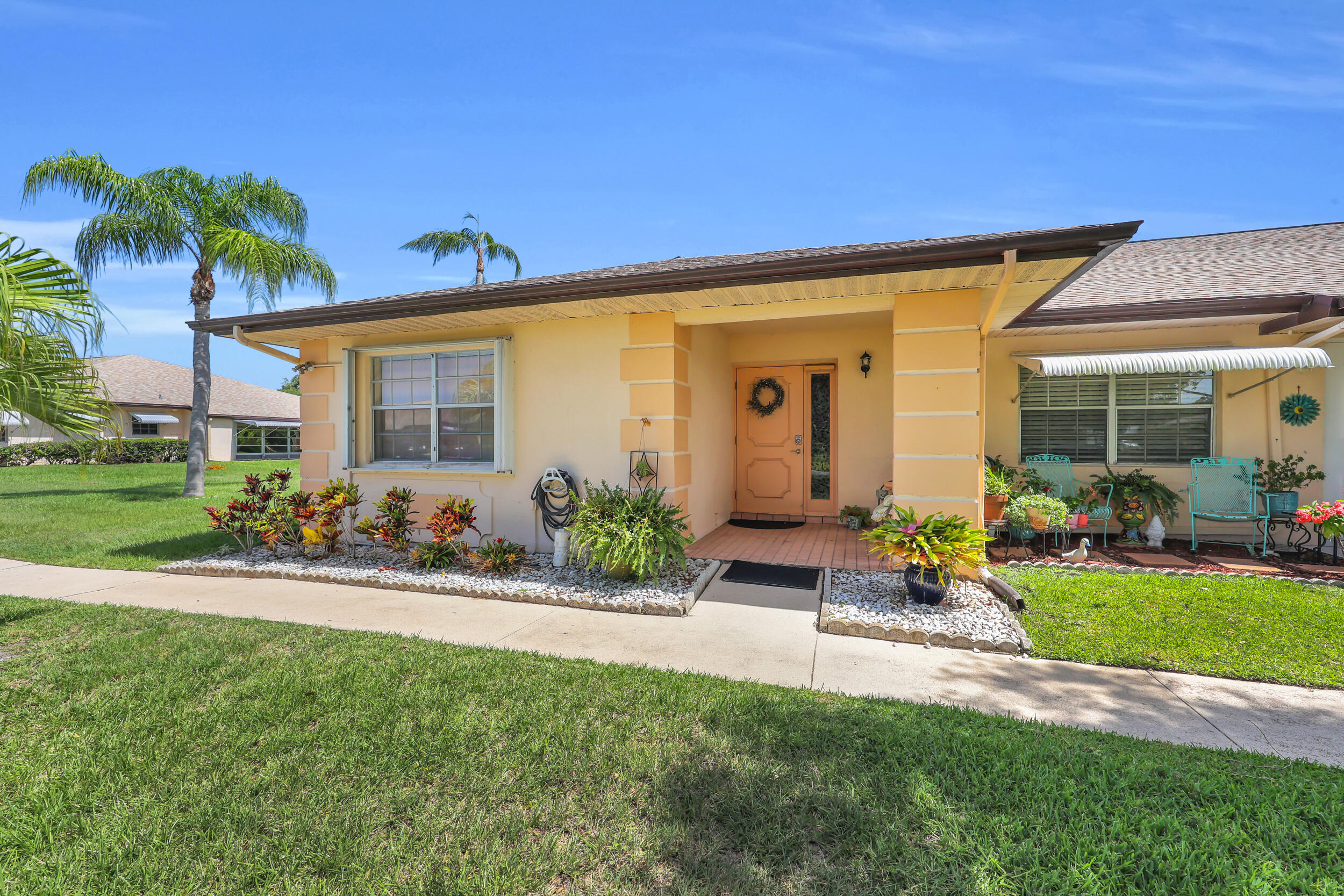 Welcome to the sought-after 55+ community of Palm Grove in Fort Pierce! This beautifully maintained 2-bedroom, 2-bath home features a desirable split-bedroom floor plan, offering privacy and comfort for both owners and guests. Tranquil lake views create the perfect backdrop for relaxing and enjoying Florida's beautiful weather.  Designed for low-maintenance living, this home allows you to spend more time enjoying the exceptional amenities Palm Grove has to offer. Residents enjoy a vibrant lifestyle with a clubhouse, community pool, and a variety of social activities in a beautifully maintained setting.  Conveniently located near shopping, dining, healthcare, golf, and the area's stunning beaches!
