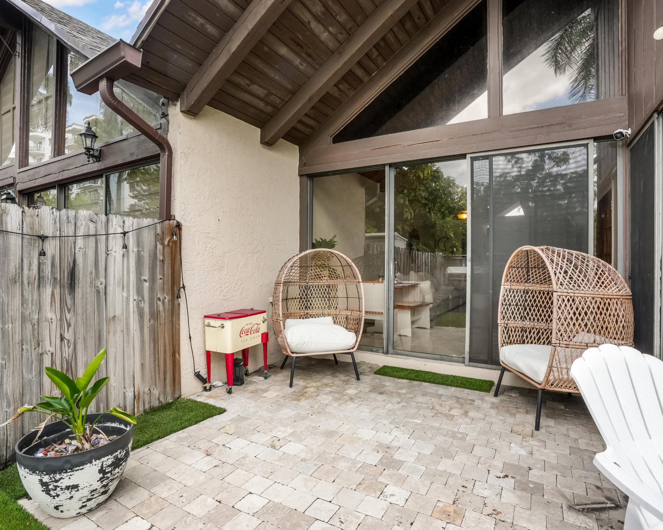 Welcome to this stunning two-bedroom, two-bathroom townhouse located in Village Townhouses in Plantation, FL. This unique residence offers 1,030 square feet of finished living space, modern updates, and fully fenced in backyard.  The thoughtful design maximizes the available square footage with loft or flex space on the second floor. Contemporary living in an unbeatable location. Just footsteps from Plantation Walk, numerous restaurants, shops, all major highways. This property is also able to be rented right away. Come see this spectacular home for yourself and make it your very own.