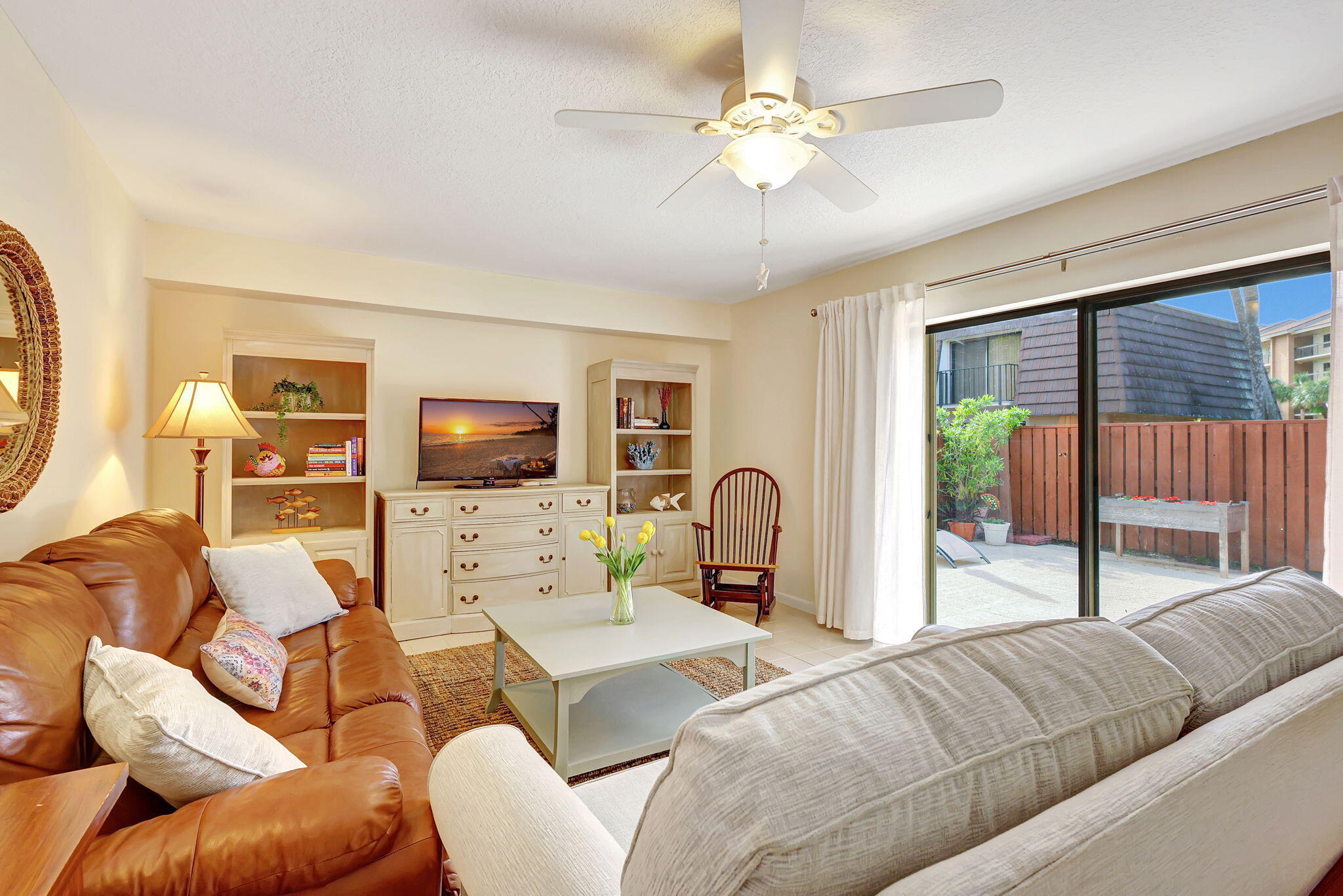 Experience the best of Jupiter's beachside lifestyle in this beautifully appointed 2 bedroom, 2.5 bath townhome available for annual lease.  Here, coastal charm meets everyday convenience, with a location less than one mile from Jupiter Beach, the Juno Pier & Bluffs Square Shoppes. This fully furnished, turnkey home offers a light & inviting floor plan with an entry-level living, dining & kitchen area that wraps around a spacious private courtyard, creating seamless indoor-outdoor flow, perfect for relaxing, entertaining & enjoying the ocean breezes. The kitchen features quartz countertops and abundant natural light; and, a convenient half bath with laundry area completes the main level. Upstairs are two spacious bedrooms and two full baths. The primary suite offers a huge walk-in closet, updated ensuite bath, and a private balcony overlooking the courtyard. The secondary bedroom includes twin beds, a large closet, as well as its own balcony retreat.  Freshly painted and move-in ready, this home is equipped with a 3-year-new A/C, 5-year-new water heater, and accordion shutters for peace of mind. It's located in the coveted, amenity-rich community of The Lakes at the Bluffs, perfectly positioned between the Intracoastal Waterway and the Atlantic Ocean to capture the true essence of Jupiter living.  Community amenities include a resort-style pool, tennis & pickleball courts, outdoor racquetball, and a children's playground/tot lot. The Bluffs Square Shoppes, just around the corner, offer every convenience to meet your daily needs: Publix, Walgreens, UPS, fitness studios, great restaurants, shops & personal services.  Living here you'll be an arm's length from everything that defines the Palm Beaches...championship golf, world-class marinas, beautiful parks, boutique shopping, and incredible dining. Plus, you're also just 10 minutes from Roger Dean Stadium and 20 minutes from Palm Beach International Airport.  Lease Details: Furnished annual rental @ $2700/mo (includes cable, internet & two assigned parking spaces). Furnished Seasonal rental will be considered @ $5500/mo (3-month minimum, includes all utilities & 2 parking spaces) Owner prefers no pets.  Everything you need for a relaxed, beach-inspired lifestyle is right here, ready for your arrival. Schedule your private showing today.