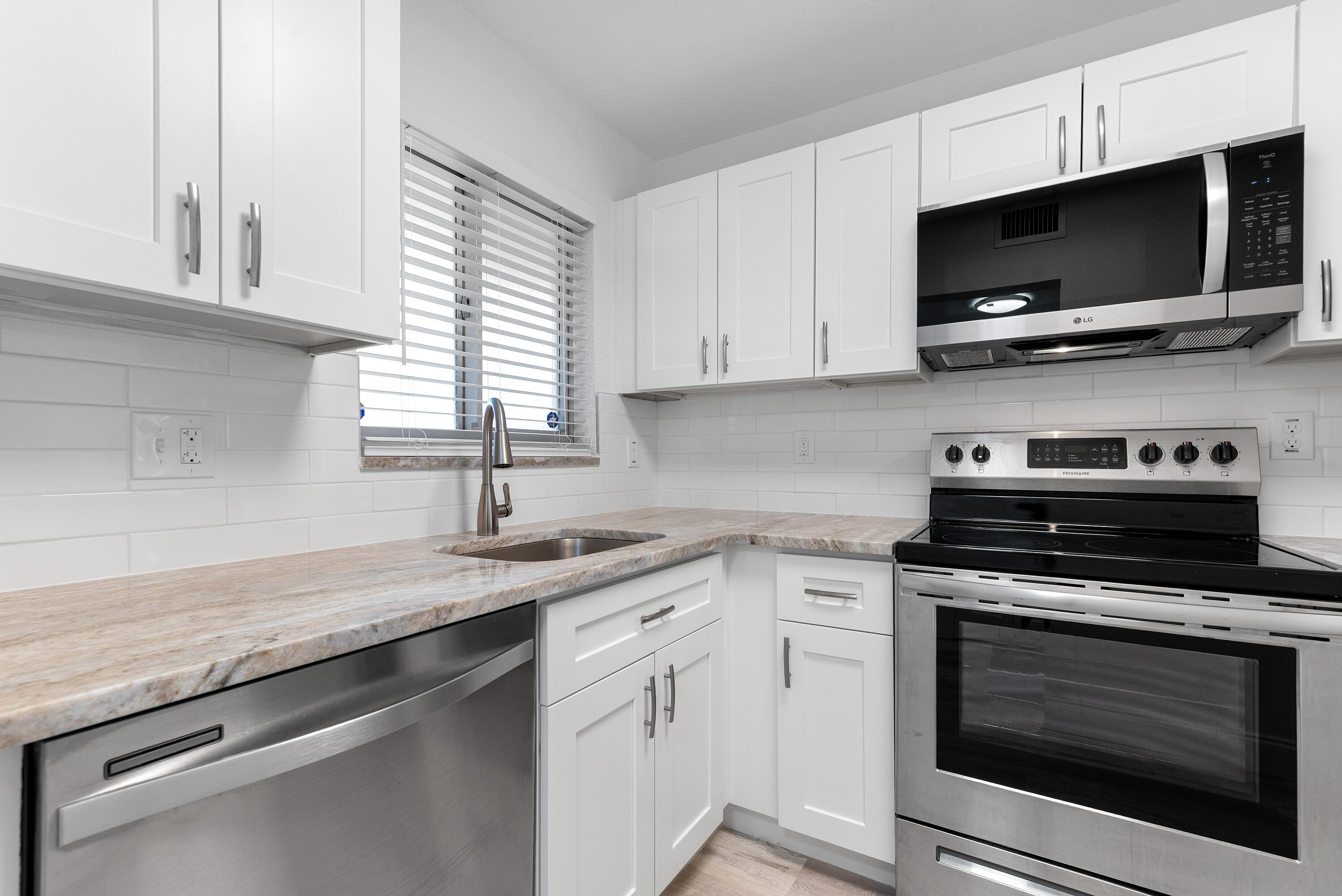 Fully renovated 2BR/2BA condo in Sunrise Lakes Phase 1, a 55+ community. This ground-floor, corner unit feels like a single-family home with the ease of condo living. Renovations completed with permits—new electrical, kitchen, bathrooms, flooring, paint, and more. No expense spared! Enjoy your morning coffee on the walkout screened-in patio or take advantage of community amenities. Maintenance-free lifestyle in a vibrant, active adult community. Schedule your private showing today! This property qualifies for a mortgage rate buydown of up to 3%!