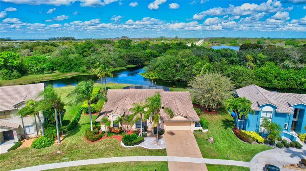 Don't miss one of the best lots in West Boca, spanning over 1/3 acre lot. Located in the desirable man-gated community of Island Lakes of Logger's Run.  Enjoy this private backyard oasis with expansive water views jutting out to a nature preserve. Enjoy sunsets from your screened lanai with pool and raised spa views. Kayak or Paddleboard from your backyard. This floor plan features formal living room, formal dining room, plus a large family room and kitchen with breakfast nook and snack counter. Accordion shutters protect the whole home and provide peace of mind. Master bedroom features walk-in closet with custom shelving. Home is conveniently located close to shops, dinning, and zoned for one of the most desirable school systems.