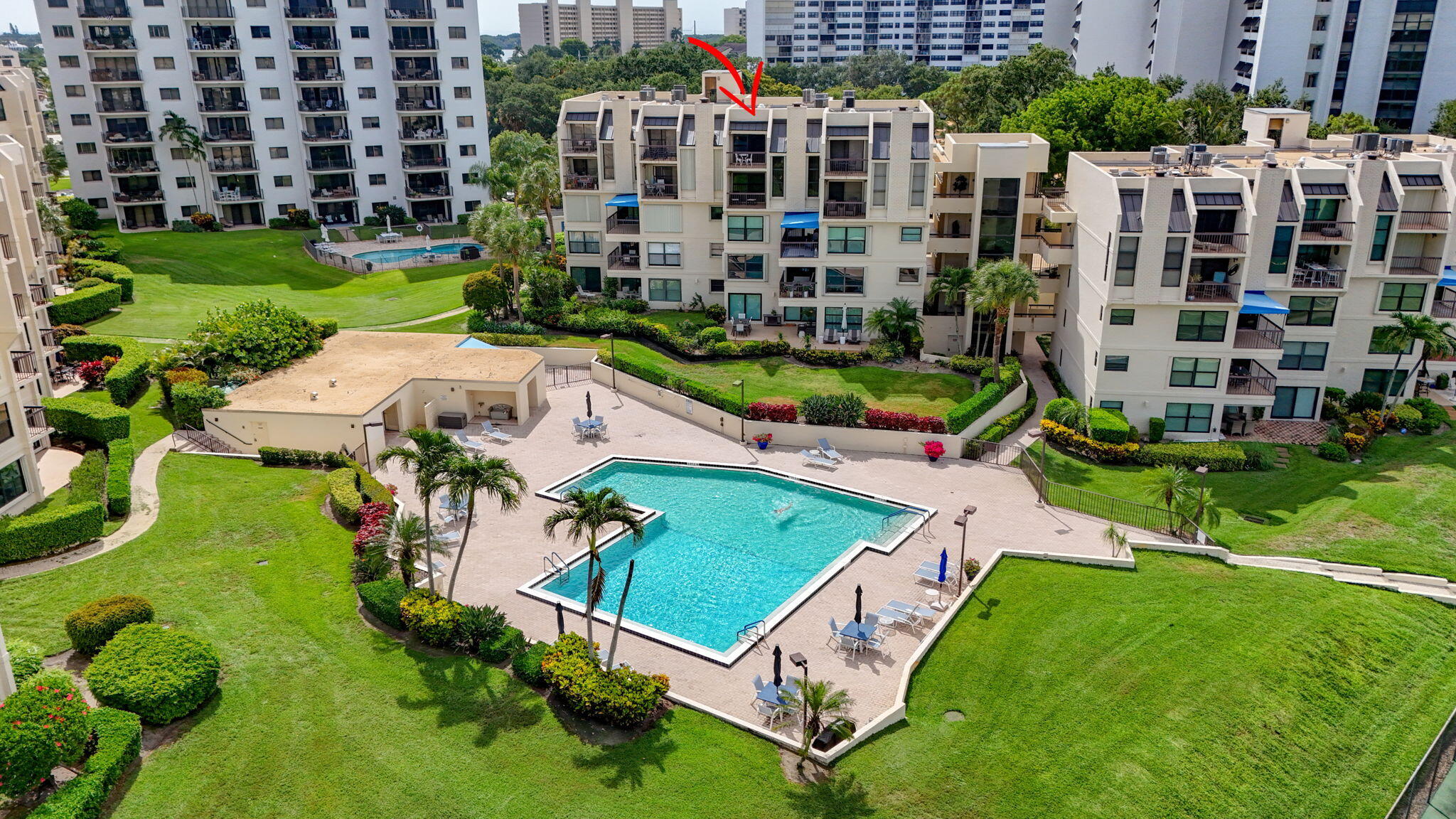 Enjoy spectacular Intracoastal views from this spacious 2-bedroom + den residence that lives like a townhome, offering over 1,900 square feet of comfortable living space. Watch yachts and kayaks glide by from two private balconies, the living room, and the primary suite. The expansive primary retreat features a large en-suite bath and generous walk-in closet. Impact windows and sliders provide abundant natural light and peace of mind. Recent updates include a new roof, newer A/C, new water heater, updated guest bath, fireplace, and newer kitchen appliances. Located in The Everglades, a boutique waterfront condominium community with a pool overlooking the Intracoastal, tennis courts, covered parking, and additional storage. Just minutes from beaches, golf, shopping, and dining