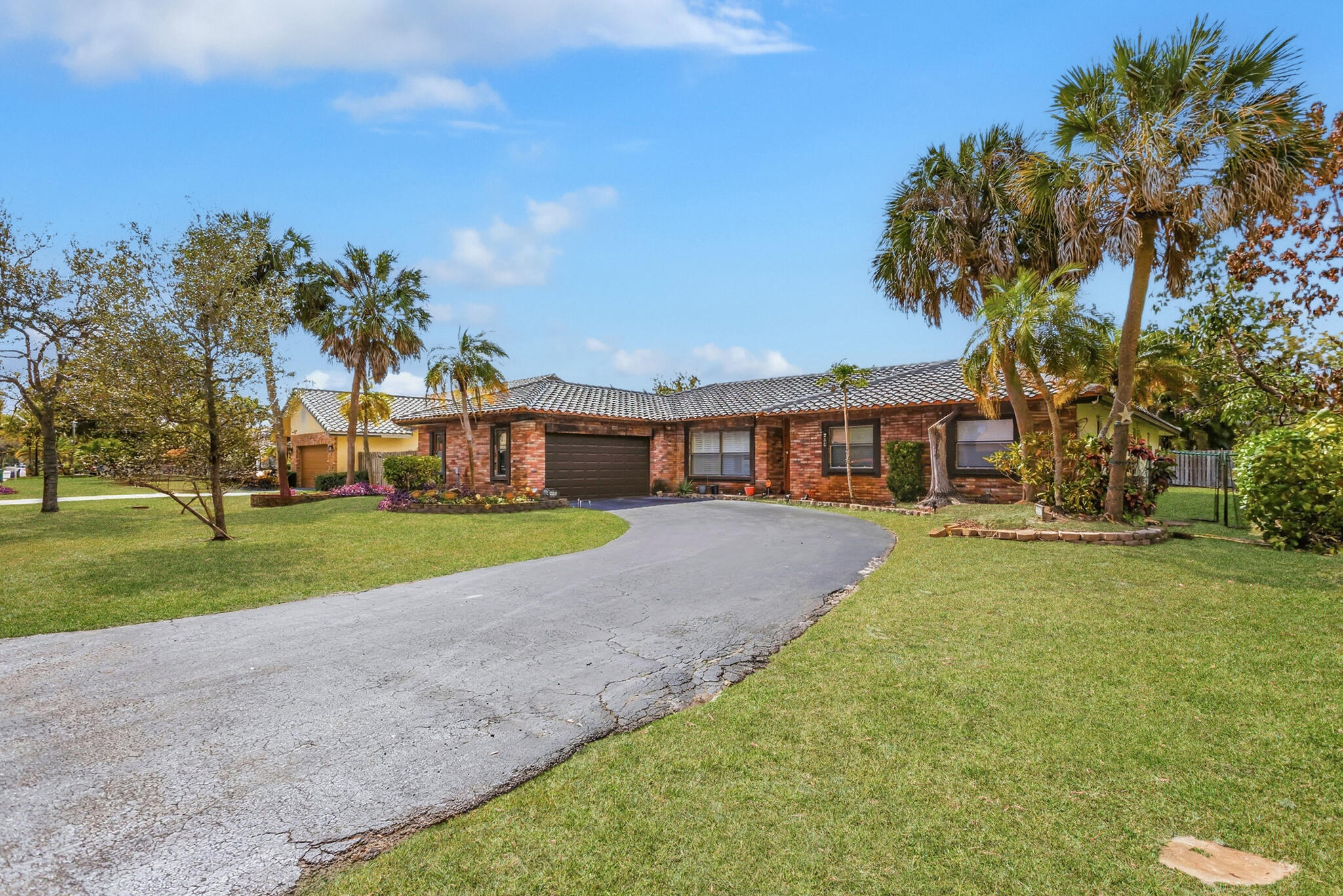 Welcome to this spacious and well-maintained 1-story residence located in the heart of Coral Springs! This 4-bedroom, 2.5-bathroom home with a 2-car garage offers an ideal layout for both comfortable living and entertaining. Roof 2015. Ac 2020. Garage Door 2019 Step inside to find generous living areas filled with natural light and a functional split-bedroom floor plan. The primary suite is a true retreat featuring oversized walk-in closets and a large ensuite bath with dual vanities and separate his-and-hers sinks. The outdoor space is a standout feature -- enjoy a beautifully designed backyard with a sparkling pool and wood terrace, perfect for relaxing evenings, weekend gatherings, and year-round Florida living. Major updates provide peace of mind, including a new roof (2015), A/C system (2020), garage door (2019), water heater, and pool pump. All windows are equipped with hurricane shutters for added protection and insurance savings. Situated in a fantastic neighborhood within a highly desirable school zone and close to parks, shopping, dining, and major roadways, this home presents an excellent opportunity to own in one of Coral Springs' most sought-after areas. Don't miss your chance to make this move-in ready property your own!