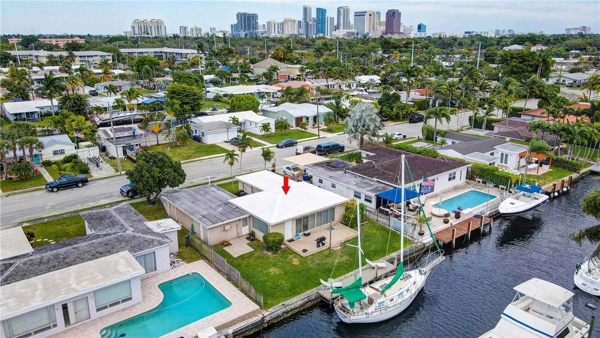 Avid boaters, this is your opportunity to own a waterfront home in the much-desired Citrus Isles! This property features a huge two-car garage a large laundry/utility room which could be configured as a 3rd bedroom. 65 feet of deep waterfront, ocean access with no fixed bridges, and a private dock. The property can accommodate a vessel up to 55 feet. Take the dingy out for a night on the town and visit restaurants on the New River. This home will make a great primary residence and a fantastic investment! Why pay for dock space or storage when you can keep your boat at home in your own backyard! Excellent location close to Las Olas, trendy shops and restaurants, nightlife, and award-winning beaches. Minutes to airport, I95, I595, and Port Everglades.