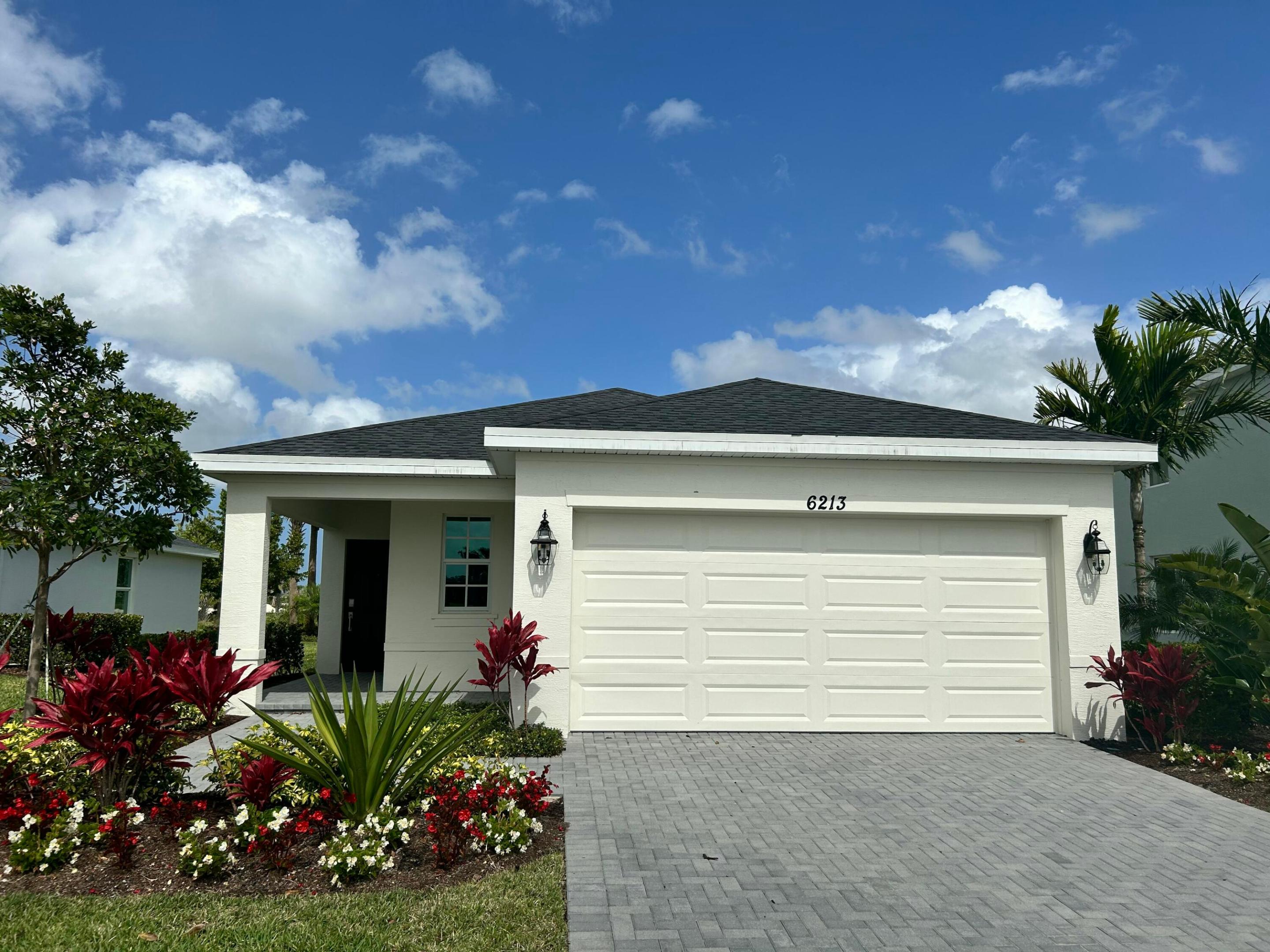 This single-story home features a smart layout that prioritizes ease of living. Down by the foyer is an open-plan design shared by the kitchen with a center island, dining room and family room, which extends out to the covered lanai. On the opposite side of the home are two bedrooms to provide a restful retreat and a den well-suited for as a private office. At the front is a versatile two-car garage.

Photos are for illustrative purposes only.