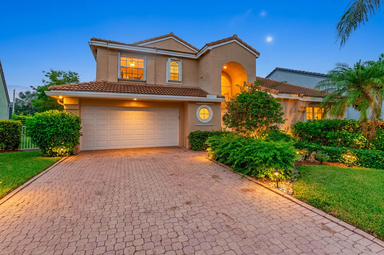 Beautifully updated 4-bed& 2.5-bath home located in a desirable 24-hour manned gated community. This move-in ready residence features a spacious open layout with soaring vaulted ceilings and abundant natural light throughout.  The renovated kitchen showcases white shaker cabinetry, quartz countertops, stainless steel appliances, a built-in wine cooler, LED lighting, and modern finishes that make it the heart of the home.  The primary suite is conveniently located on the first floor and offers a large custom walk-in closet along with a beautifully remodeled en-suite bath featuring dual vanities, stone countertops, a frameless glass shower, & elegant designer finishes.  Upstairs, you'll find generously sized secondary bedrooms along with an updated full bath.Seller entertaining all offers. Additional improvements include porcelain tile flooring throughout the main living areas, upgraded flooring upstairs, fresh interior paint, an updated garage door opener with keypad entry and safety sensors, and a newer washer and dryer.  With over $100,000 in quality upgrades, this home has been thoughtfully renovated and meticulously maintained. Simply unpack and enjoy.
