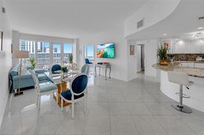 Enjoy beachfront living at its finest from this turnkey penthouse-level annual rental. This beautifully renovated 2-bedroom, 2-bath residence offers stunning ocean and Intracoastal views through floor-to-ceiling impact windows in every room. The spacious eat-in kitchen is perfect for entertaining, while matching tile flooring flows throughout the unit. The primary suite features a large walk-in closet and an updated bath with dual sinks and a tub/shower combination. Washer and Dryer in unit. Offered fully furnished with contemporary furnishings, this home is move-in ready. Two garage parking spaces included. Rent includes all utilities except electric and renter's insurance. Building is currently undergoing concrete restoration, and the balcony is temporarily closed during construction.