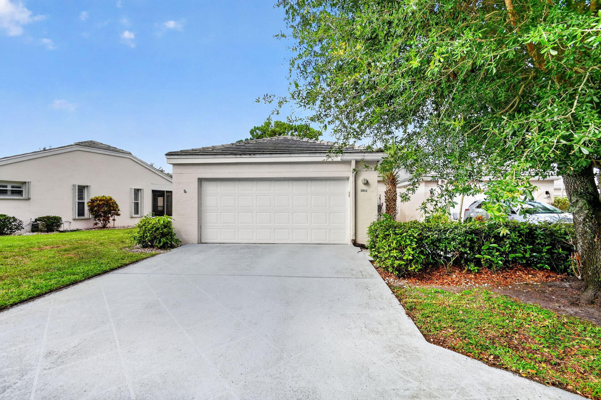 Welcome home to resort-style living in the community of River Bridge. This open and spacious corner unit villa features 3 bedrooms, 2 bathrooms, and a 2 car garage. The property features a new roof installed in 2020. The split floor plan and high ceilings create a spacious and airy atmosphere. Enjoy tranquil and peaceful water views from the covered and screened patio. River Bridge is a resort-style, gated community that offers many amenities, including a clubhouse with 2 pools, fitness room, billiards room, tennis and pickleball courts, and more. The villa is located in the exclusive "Island" subdivision, which has its own private pool.HOA fee includes basic cable, internet, and a manned gate for added security. Don't miss the chance to make this delightful property your new home.