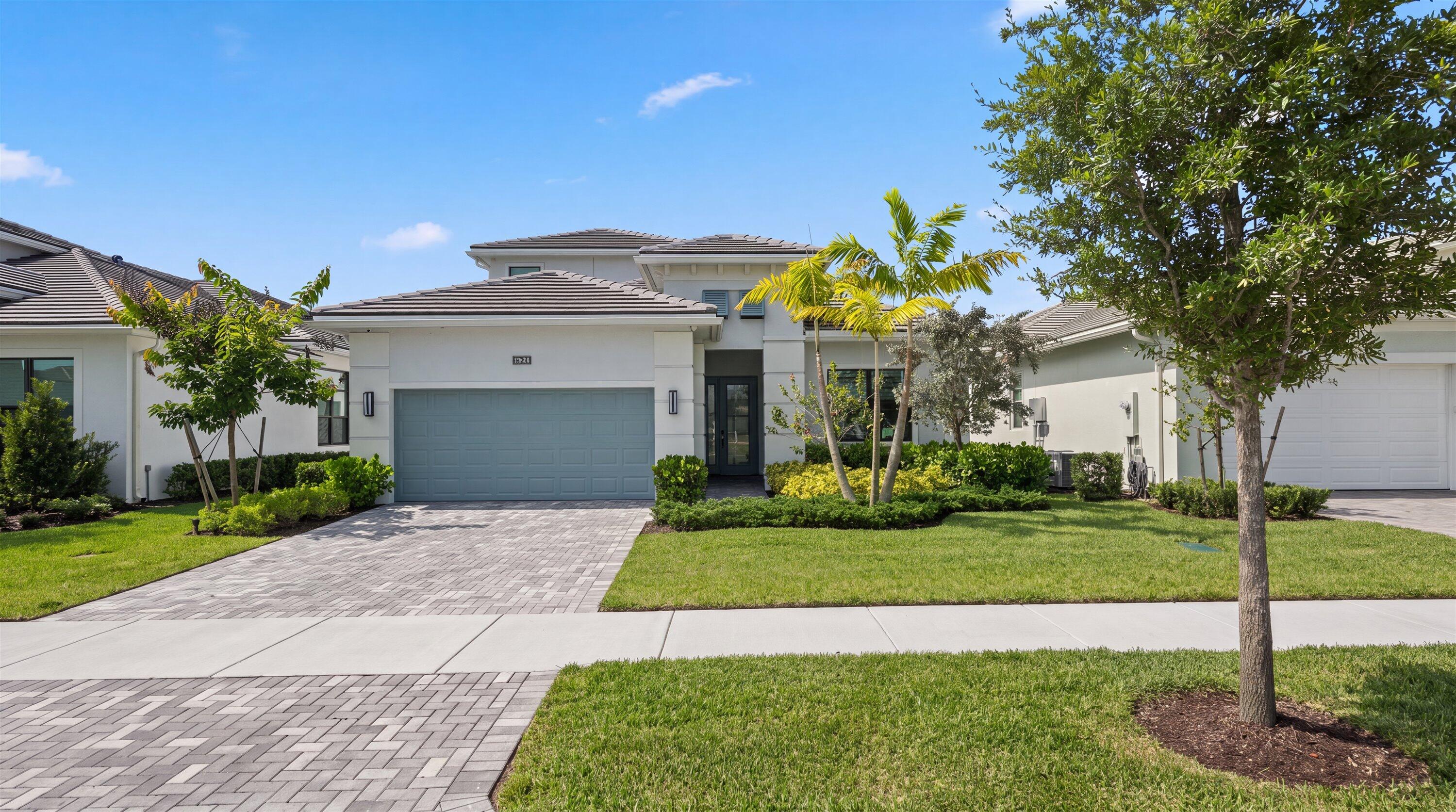 Rarely does a home of this caliber become available—where nearly every finish, system, and feature has been thoughtfully upgraded far beyond the builder's original design. With over $550,000 in documented upgrades, this exceptional residence offers a level of luxury, innovation, and thoughtful design that sets it apart from anything else on the market. Inside, soaring ceilings, wide-plank wood flooring, oversized tile, flat stock molding throughout, upgraded lighting, elegant custom window shades and draperies, and an expanded living room with a recessed TV wall create a refined yet welcoming atmosphere. Built-in surround sound, Control4 smart home automation, and premium finishes elevate everyday living. The gourmet kitchen was designed to impress, featuring Monogram appliances, a 36-inch cooktop, statement hood, pot filler, wine cooler, under- and upper-cabinet lighting, custom drawer organizers, a wraparound island, and a walk-in pantry with upgraded wood shelving. The luxurious primary suite includes custom closet systems with additional storage, while the spa-inspired bath showcases floating vanities, smart mirrors, medicine cabinets, upgraded fixtures, floor-to-ceiling tile, and a linen closet. Upstairs, the spacious loft provides exceptional flexibility for a media room, game room, or second living area, while the thoughtfully designed guest suite offers a private bedroom and full bath—ideal for extended overnight guests. Outdoor living rivals a private resort with a $150,000 custom smart pool, Cat 5 hurricane screens enclosing the lanai, landscape lighting, pool fencing, and additional pet-safe fencing, creating a private backyard retreat designed for year-round enjoyment. Even the garage has been elevated beyond expectations with a raised insulated garage door, side-mounted opener, foam-insulated ceiling, custom storage systems, attic storage complete with a convenient dumbwaiter lift, and exceptional organization rarely found in residential homes. Additional upgrades include an etched glass front door, quartz laundry sink, soft-close cabinetry, custom built-ins, beautifully appointed window treatments, customized closets throughout, and designer light fixtures that convey, along with one mounted television. Every detail has been intentionally selected to create a home that delivers an exceptional blend of comfort, sophistication, and everyday functionality. Beyond the home itself, Cresswind Palm Beach offers an unmatched 55+ lifestyle with resort-style amenities, an award-winning clubhouse, state-of-the-art fitness center, pickleball and tennis courts, walking trails, and a vibrant social calendar that makes every day feel like a getaway. Homes with this level of customization, craftsmanship, and attention to detail are exceptionally rare. As an added opportunity, the seller is willing to consider holding paper for qualified buyers, offering additional flexibility in financing. This is a truly one-of-a-kind residence that must be experienced in person to fully appreciate everything it has to offer.
