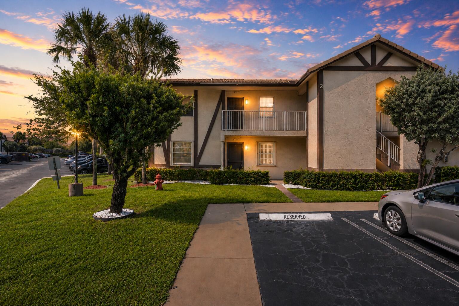 Welcome to this cozy, freshly painted, and well-maintained first-floor lakeview condo in Brittany Court of Coral Springs. This spacious 2-bedroom, 2-bath split floor plan offers both comfort and functionality, featuring a primary suite with a walk-in closet, ample storage, and a spacious shower.     The updated kitchen showcases granite countertops, raised-panel shaker cabinetry, and a stylish backsplash. An in-unit washer and dryer add everyday convenience. Relax and enjoy peaceful lake views from the screened-in patio, plus added peace of mind with accordion shutters throughout.     HOA fees include water, sewer, and trash removal. Residents also enjoy access to the community pool and the convenience of a dedicated parking space located directly in front of the unit. Ideally located just minutes from The Walk, shopping, dining, parks, and everything Coral Springs has to offer.  Don't miss this move-in-ready gem — schedule your private showing today!