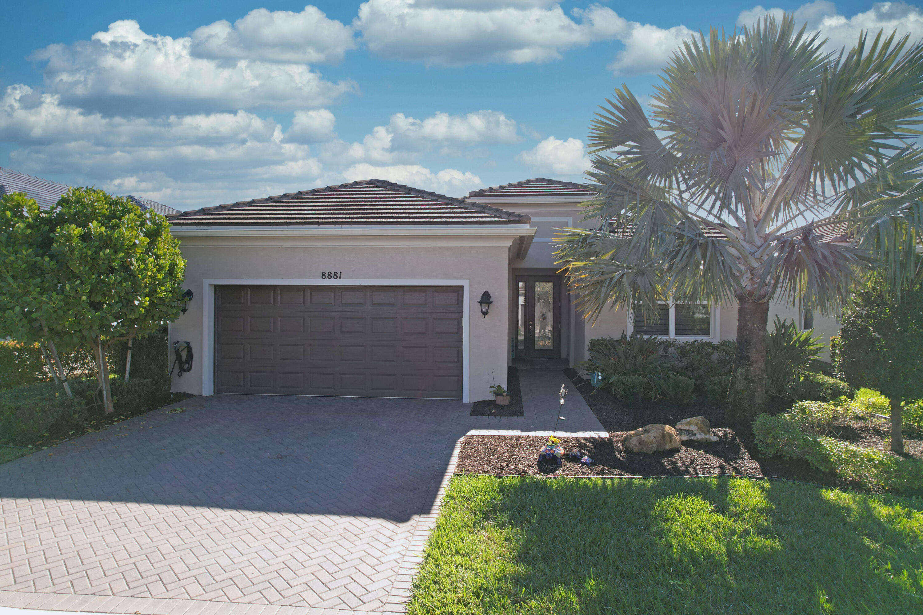 Enjoy the Cresswind at Verano 55+ lifestyle in this beautiful lakefront Davis model featuring impact windows throughout. The upgraded kitchen offers quartz countertops, center island, stainless steel appliances, and a bright eat-in dining area. This home also includes a formal dining room and a versatile flex room perfect for an office or den. The spacious primary suite features a master bath with dual sinks, a large walk-in shower, and a generous walk-in closet. Enjoy a quiet, peaceful backyard with serene lake views from the screened-in lanai. Relax and take advantage of all the resort-style amenities Verano at PGA has to offer.
