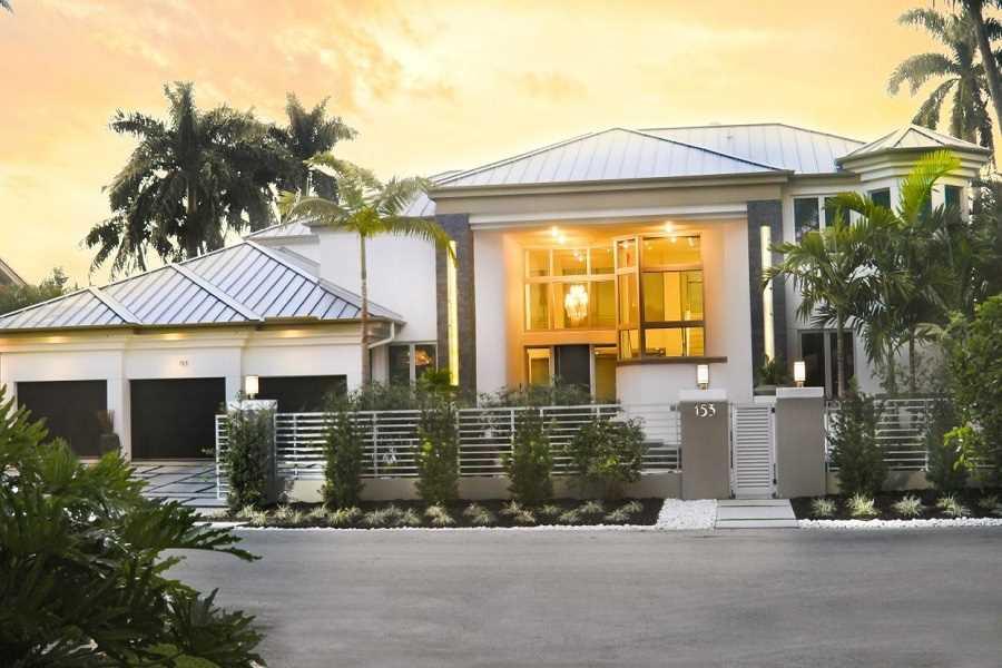 Zen vibe & ecological hi-tech green elements.  Silver LEED certification.  22 foot ceilings, Low-E impact glass. Warm & cozy yet modern. Special folding doors bring outside in. Perfect for entertaining. Heated pool & spa. 100' deep water dock, 120' wide c anal & quick ocean access. Chef kitchen, 11' stainless steel island. Master with fireplace, exotic master bath. 3 car garage. Smart house & cameras, generator, water conditioning system. Street has underground utilities & high elevation. 2012 100% remodel