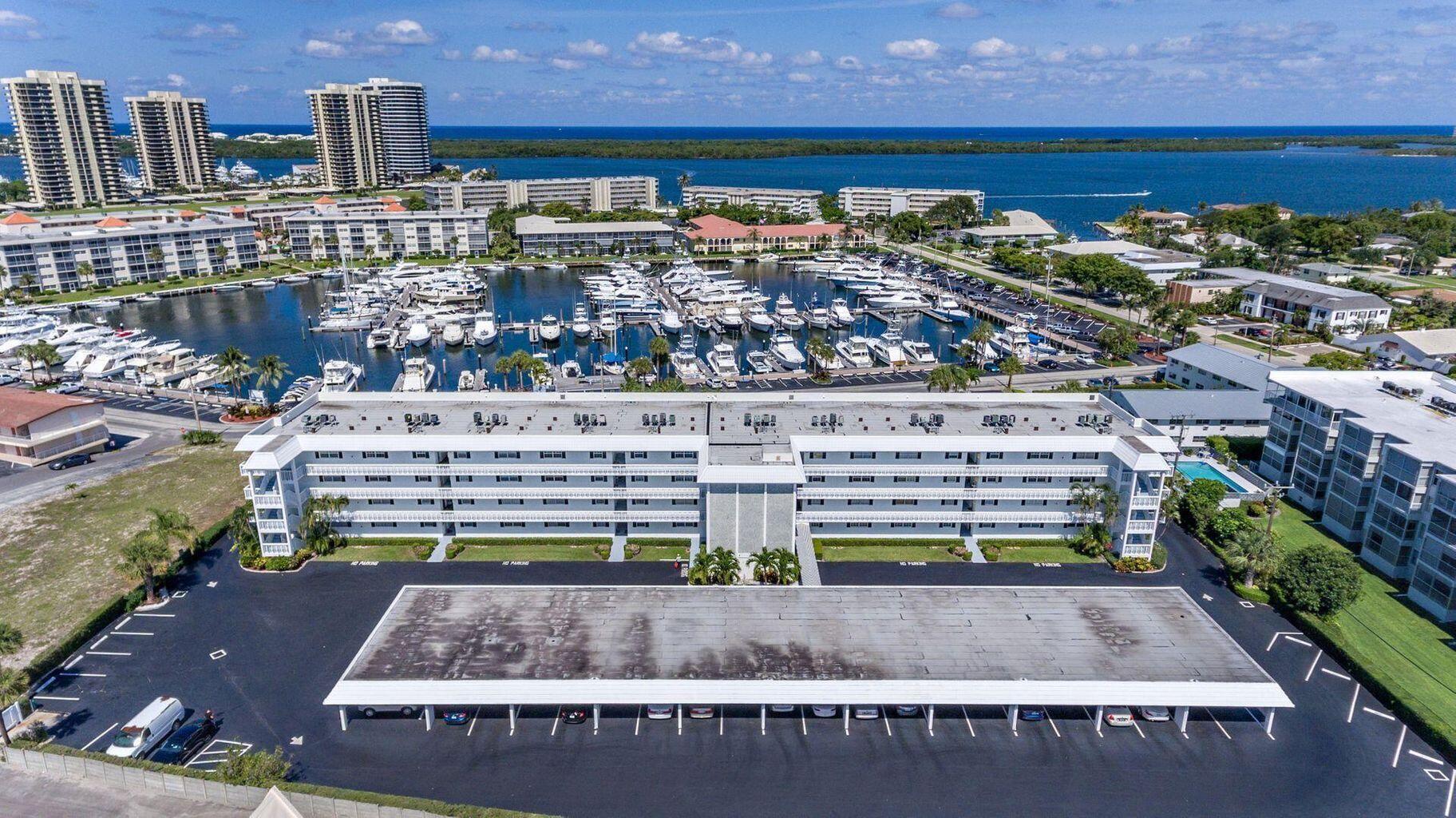 Ocean breezes & Marina Views awaits you from this gorgeous, renovated corner unit.  Beautifully furnished 2 bedroom 2 bath w/ large kit, quartz counters, s/s appliances, tile & wood style flooring throughout. Watch the sunrises with your breakfast on your covered screened enclosed patio & your sunsets from your kit in the evening, Stroll down to the marina or walk to No Palm Beach Country Club featuring a golf course designed by No Palm Beach resident Jack Nicklaus. Enjoy lunch, dinner, golf, tennis, pickleball or just enjoy the ocean breezes nearby. Minutes to beautiful beaches, 1st class shopping, Palm Beach International airport, Wall Street South, Gardens Mall, upscale restaurants, Boating & so much more!