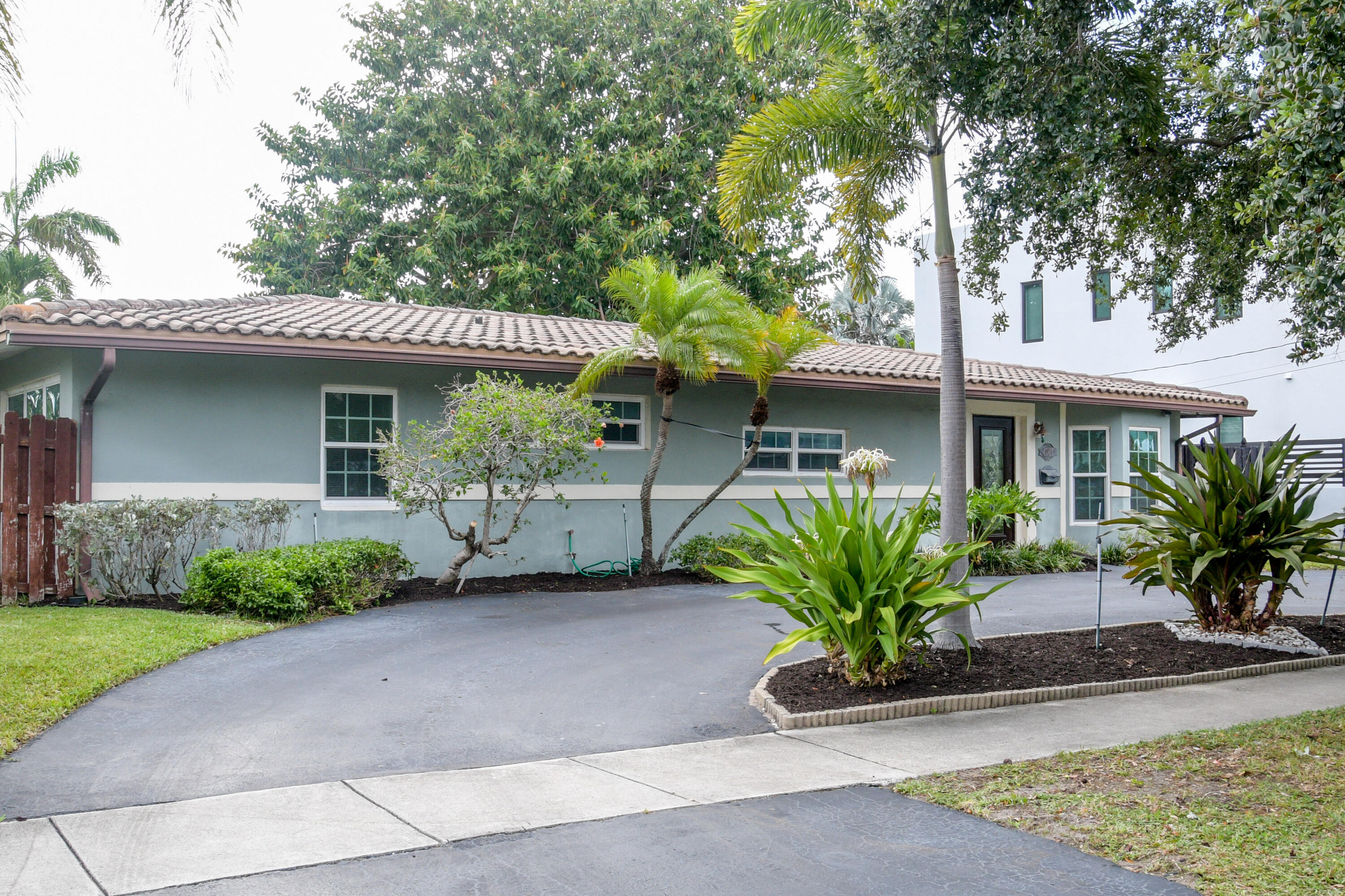 Opportunity awaits in this 3-bdrm, 2-bath pool home located in a prestigious, established neighborhood surrounded by million-dollar residences. Impact windows & doors provide peace of mind. Enjoy the spacious fenced yard with a beautiful private pool, complete with a heater system. There is plenty of space for family, pets and entertaining. A backyard shed is perfect for all of your storage or yard tools. The circular driveway accommodates numerous cars. The electrical panel has been updated.  AC 2022.  With a location close to Federal Highway, the beaches are a short drive. I-95 is close for commuting. Stores and restaurants are plentiful! No HOA! This home is ready for your updates and personal touches.