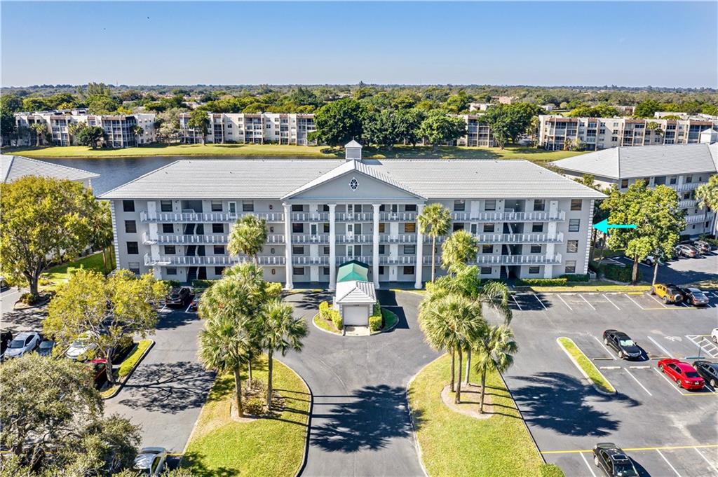 Stunning Light and and Tree-Lined Lake Views are Yours in this Spacious Corner Unit 2 Bedroom/2 Bathroom Residence w/Full-Sized Laundry Room + BONUS 3RD Bedroom/Storage/Office Area. New Upgrades Include: Impact Windows, Plantation Shutters, and New Stainless Steel Refrigerator. FREE Home Warranty Gifted at Closing! Close to Satellite & Main Pool/Clubhouse. Located in the Sought After Pine Island Ridge Country Club w/Full Amenities Including: Pool, Fitness Center, Restaurant, Sports Bar, Sauna, Steam Room, Tennis, Golf, and More! Close to Shopping Centers, Great Restaurants, Schools, & Transportation. Maintenance Includes: Water, Basic Cable, Trash Removal & Pine Island Ridge Country Club Membership!