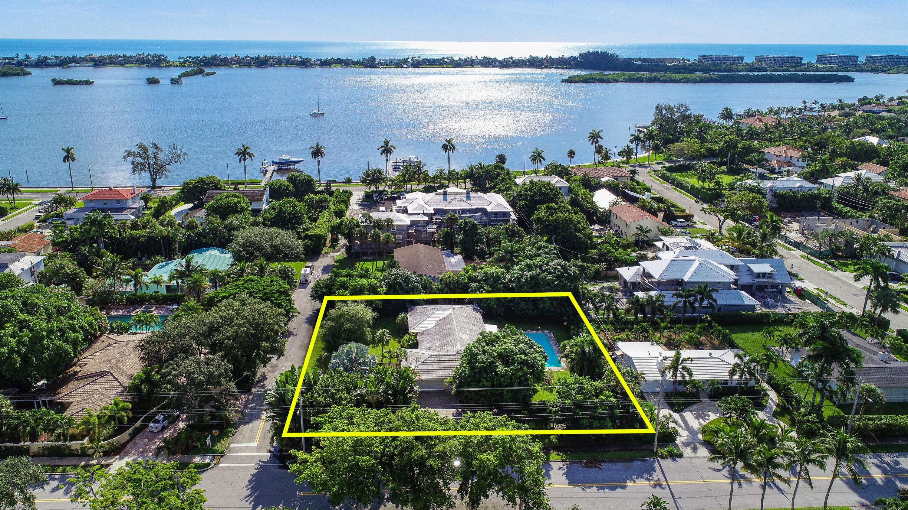 Exceptional opportunity in the lake block of the South of Southern neighborhood. Renovate, tear down, or potentially subdivide. Current home is a charming 3 bedroom/3 bath with large swimming pool, spa, 2 car garage, and endless potential. Impressive corner lot of rare size boasting over 26,195 +/- square feet (155 front x 169 depth). Located in a private enclave only 2 homes off the Intracoastal with direct access to Flagler Drive and Summa Beach. Great for developers or end users. This estate-sized property offers incredible potential and possibilities on one of the most desirable streets in the South End. Located in the South Olive Elementary school district and minutes from downtown West Palm Beach, PBI airport, I-95, Palm Beach, The Square, Worth Ave and the area's best restaurants.