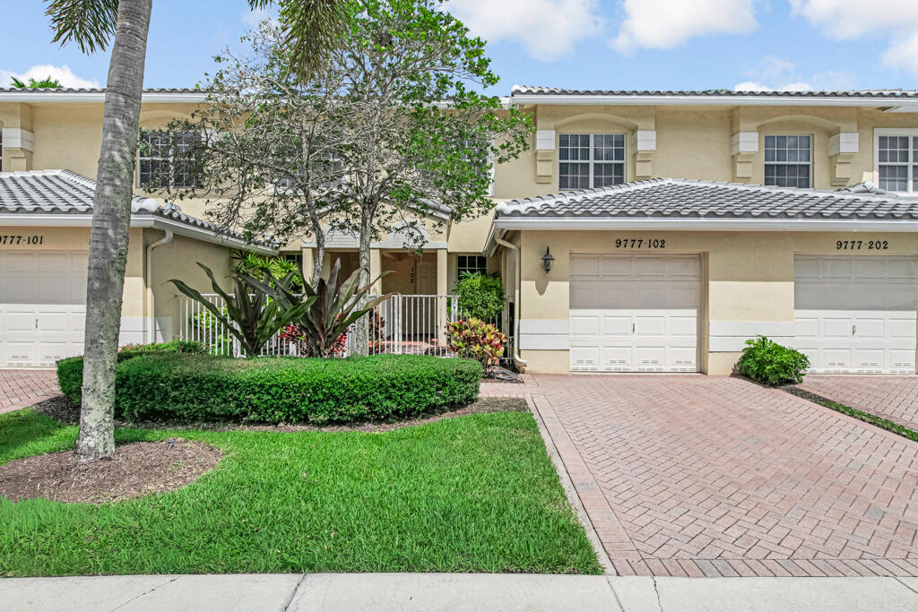 This lake front coach home has a brand-new roof, new AC with 10-year warranty, impact windows and new refrigerator! This unit has also been recently painted throughout the interior. The home has been meticulously cared for by its original owners. Over 1900 Square feet in this Spacious 2 bedrooms, 2 full baths, 1 car garage! HOA fee includes roof maintenance/replacement, building maintenance and INSURANCE, painting, water, landscaping, pest control, high speed internet, premium cable channels, home ADT alarm, home phone, 24-hour guard gated guard house, all the amenities at the clubhouse which include Bocce, Pickleball, Tennis, resistance pool, lap pool, fun pool, jacuzzi, equipped gym, cards, crafts, bingo, library, ballroom featuring many shows, billiards, and clubs. 55+ 80/20 rule! 80/20 rule applies in Baywinds. Any age allowed with no one under the age of 19 residing in the home!! The clubhouse will be undergoing a renovation soon! It will be modern, sleek and gorgeous!