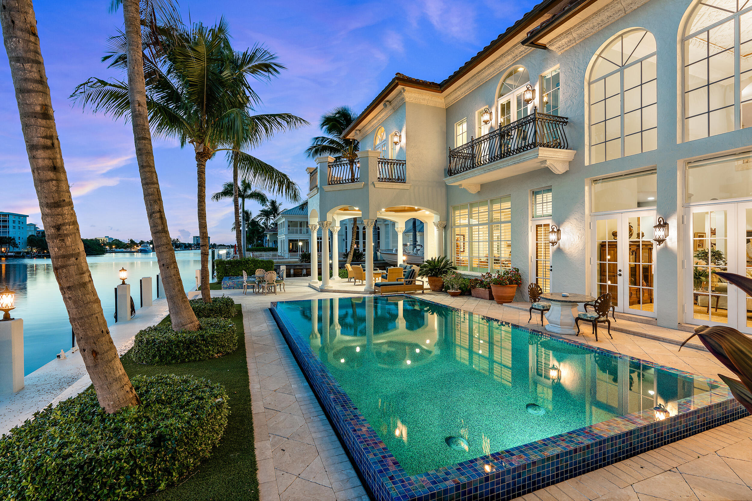 THIS IS IT! If you have been looking for the PERFECT WATERFRONT home where you can keep not just one, but TWO 100+ foot yachts directly on the Intracoastal and in walking distance to the beach - this EXQUISITE estate has everything you have been searching for and more! 
Situated at the end of a cul-de-sac on a premium point lot, this STUNNING home is the definition of South Florida luxury living and is ready for you to make your own. Boasting luxurious outdoor space, including a sparkling heated salt-water pool and spa, summer kitchen, and waterfront that wraps around the property with views from every vantage point of the home, this property embodies the elegantly casual Delray Beach lifestyle. RENOVATED master suite, home theater, IMPACT windows, generator and so much more! {continue on The private residence is nestled at the end of a quiet cul-de-sac on one of the most desirable streets in Delray Beach - Rhodes Villa.  Just one short block from the beach, and less than a fifteen minute breezy walk along the ocean to the shops and dining of Delray Beach's Atlantic Avenue. Yachts and boats of all sizes will appreciate the Intracoastal water frontage with no fixed bridges, in a no-wake zone, with expansive private dockage for multiple vessels. 
Recent upgrades include complete renovation of everything from the expansive master suite, pool and spa, paint- interior and exterior, whole home water filtration, generator, and roof. Other features include the coffered 20 ft ceilings, exquisite millwork, and new plantation shutters in the formal living and dining rooms; upgraded surround sound theater; large kitchen with a trayed, tongue and groove Pecky cypress ceiling, no maintenance artificial turf around the grounds, and updated electrical for the dock and boat lift. 

You will fall in LOVE with every aspect of this gorgeous estate, from the moment you pull down the quiet street and onto the decorative brick and turf driveway that provides ample parking for residents and guests alike. As you walk up to the stately portico entryway and pass through the towering IMPACT double doors into the grand foyer, you'll look out past the formal living room, through the three sets of glass french doors and floor to ceiling windows, out onto the gorgeous pool overlooking the beautiful blue intracoastal. As you continue inside, you will walk across the Turkish marble floors, noting the custom molding and oversized baseboards as you enter the formal living room with soaring high ceilings, oversized chandelier and custom stone fireplace. 

Enjoy hosting guests with the extensive full bar, mini-fridge, ice maker, and wine cooler in the formal living room, with additional wine storage in the custom wine room just off the kitchen. 
Host more intimate gatherings in the formal dining room, with service from the expansive chef's kitchen featuring pecky cypress ceiling, Wolf GAS six-burner range with double ovens, separate wall oven, microwave, two dishwashers, an oversized Sub-Zero side-by-side refrigerator, and plenty of storage with the detailed cabinetry. The spacious kitchen continues with the large chef's island, built-in desk, and large breakfast area that opens into the family room, which also overlooks the pool and intracoastal. Another set of french doors lead out to the covered loggia, with one of three first floor powder rooms, this one offering an access door to the pool. 

The south hallway leads to the recently updated custom HOME THEATER with recliner seating, an additional powder room, along with a bright and light office with wood floors and french doors to the pool. 

The first of two first floor guest bedrooms with walk-in closet, built-in desk and full bath with glass shower is just across from the office. The north-end service hallway runs from the four-car garage that has been converted to a two-car garage (which can be easily converted back to a four-car garage) and expansive air conditioned studio space, through to the kitchen, offering access to the wine room; the first floor laundry room with full-size washer and dryer and laundry sink, and the second of two first floor guest bedrooms, including closet and private bath.

As you continue up the curvature of the grand stairway with wrought iron rails and marble detailing, you'll ascend to the breathtaking second floor landing, offering more views of the intracoastal, open to the formal living room and foyer below. 
The second story offers three more guest bedrooms, each with a walk-in closet, full bath, and its own balcony -- one of which is currently being used as a complete home gym. 
The club room offers a second story space to gather, and as you continue down the hall the second floor laundry room can be found with full-size washer and dryer, laundry sink, and cabinetry. Continue to the end of the hall to find the master wing, marked with its grand double door entryway. 
The master suite features a large sitting area with a morning bar, a large bedroom with expansive balcony overlooking the intracoastal evening sunsets, with two separate walk-in closets, one currently being used as a private game room. 
The first of two master baths includes a large vanity and a walk-in shower. The second master bath includes a grand double door entrance, leading into gorgeous detailed floors, a large custom tub, private sauna, walk-in shower with rain shower head, dual vanities, including a sink as well as a make-up vanity.
Escape to your own tranquil tropical paradise with landscaping, including maintenance free artificial turf with 10 year warranty. Enjoy breathtaking water views from the highly desirable point-lot while relaxing in the newly resurfaced pool and spa, or kicking your feet up on the serene patio. Entertain poolside with the summer kitchen and built-in grill under the covered loggia, offering the perfect space for al fresco dining. After taking a dip in your heated salt-water pool or coming in from a day spent on the water, rinse off in your private outdoor shower. 
This expansive property offers 11,370 total square feet, with almost 9,000 sq/ft under air, featuring 6 bedrooms, 7 full baths, and 3 half baths. The five-zone a/c and two full size laundry rooms offer utmost levels of comfort, and you can rest assured in South Florida storm season with complete IMPACT GLASS, updated roof (including a new roof where a flat roof once was), and a home generator on the north side of the home. 
The fenced yard and point lot are perfect for those craving privacy, and the air-conditioned boat/fishing equipment storage room offers additional storage on the north side of the home. 
Get ready to enjoy all that gorgeous and active Delray Beach has to offer - head out for a bike ride or run along the ocean, or launch your kayaks or paddle-boards off your floating dock as you get active and explore the intracoastal waterway. If relaxing while hearing the waves crash is more your style, pack a picnic and head to the beach just one block east. Cruise up and down the Intracoastal Waterway or chart a course for the open waters with two nearby inlets for easy access to all that the Atlantic Ocean has to offer, all from the convenience of your private dock and boat lift with electric and water. 

Don't miss your opportunity to own your slice of Delray paradise today in this completely updated and show-stopping 6 bedroom estate. Schedule your private showing today!
