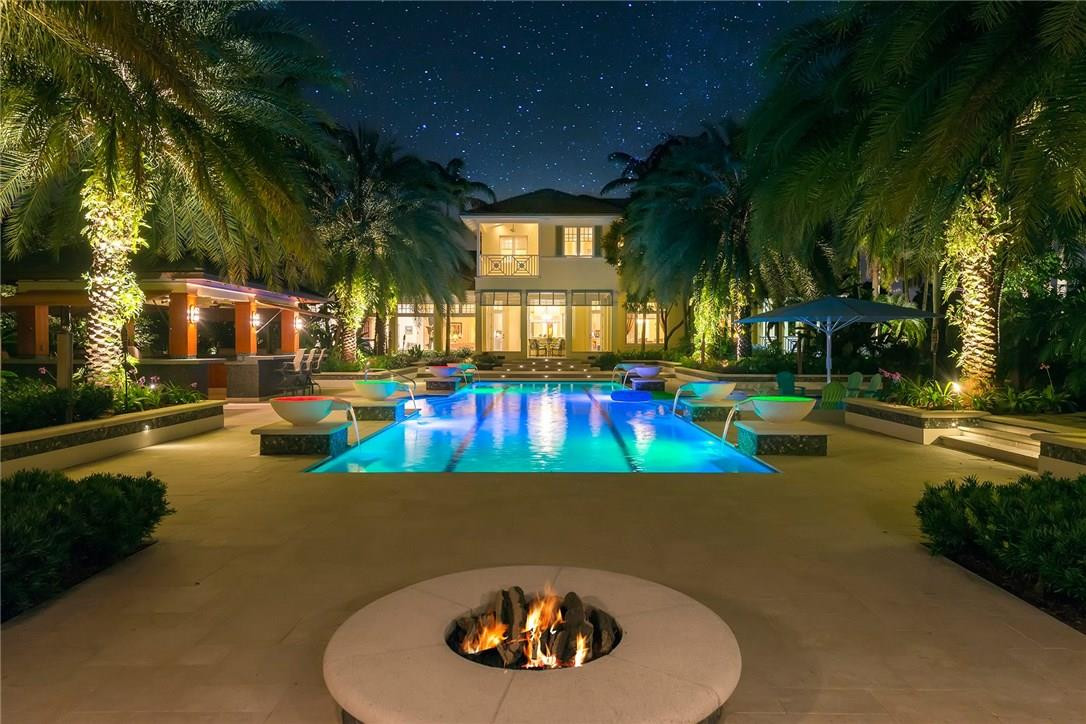 Luxury, Sophistication & Privacy bring the best a home has to offer in this Bermuda inspired Residence. Nearly 5 acres of manicured landscape, large free-form lake, elevated pond system, fruit trees, herb garden, great swimming pool with tanning ledge, summer kitchen, waterfront gazebo, outdoor fire pit, tranquility area with hammocks & misting system all in this private gated resort style property. Standby generator for full house service. Living Rm with gas fireplace, Family Rm with vaulted ceiling, formal Dining Rm, Butler's Pantry, 5 Bedrooms, 4 Baths, 4 Powder Rms, Office, sizable Gym, Game Rm, New Sun Rm, Chef's Kitchen & Much More. Truly a Distinctive Estate!
