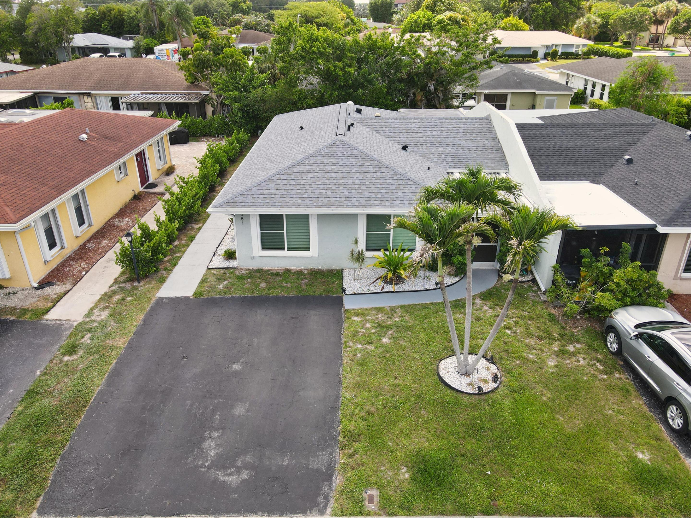 Cozy and affordable villa in Greenacres, FL with tons of upgrades. Just bring your belongings. This home has been totally renewed. Both bathrooms recently remodeled. Impact windows and doors in 2024, new AC & Water Heater in 2023, new roof  and gutters in 2024, new skylights installed in 2023, new light fixtures added, and driveway was repaved about 4 years ago. This home has been  totally remodeled and meticulously maintained. Own it today!