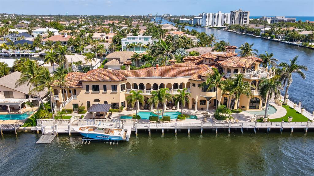 One of the finest southeast double lot direct intracoastal homesite residences in south Palm Beach county.  Designed as a 'complete' entertainment estate  in immaculate move in condition.  With 230 feet on the south canal, deep water yachts can be easily docked. 
Featuring three levels of living space, this property is one of the finest offerings of its kind with absolutely nothing missing.  See 'more' for full details.  Proof of Funds for viewing required. Home Details
Double homesite lots 308/309
Southeast intracoastal point lot. 
Classic Mediterranean estate
impact glass- majority 
Interior exterior security cameras
Barrel tile roof 
Privacy walls and gate 
Immediate canal south of property - 106 feet wide
Wrought iron automatic entrance gates.
4 car garage  with automatic doors
Marble paver driveway and walkway
Tropical landscaping
Mint condition home
Exterior security system 
12 AC 
Generator  Guardian Hawk
Exterior up lighting
Walkway  interior between main house 
Classic Mediterranean 
Interlocking pine wood ceiling. 
Creston system
Central Air Vacuum
Savan lighting 
Alarm security System - Hillman
Safety room

Garage
4 car garage 
Tile floor
Separate washer and dryer
Full storage area
Bathroom


Foyer 16x11
Neutral marble floors 
Three story foyer.
Main entry marble fountain
Marble columns
Marble clad walls
Wrought iron stair railings.
Central Chandelier extends from rotunda ceiling
30 ft high
piano area

Club/Billiards  room 25 x 19
Entertainment center, bar full bar. 
Game area
Media room 
media system 
120-inch screen
2 flat screen tv's in media room 
Media server closet
Creston system
Amplifier
Bose speaker system
Dark hardwood walls
Ice maker
Granite countertop
Small refrigerator


Formal Living Room 32 x 17
Grand decorative fireplace  Glass extends 2 stories. 
Radius glass windows that face intracoastal 
custom designOrnate ceiling 

two separate Wine rooms 
Temperature control for reds and whites

Family room 25 x 24
Bar that overlooks intracoastal , dome ceiling
Chandelier
Ice maker

 360 radius dinette area off family room overlooks pool/patio and intracoastal waterway

Kitchen 27 x 21
Chef's dream kitchen
Hardwood kitchen cabinets
Subzero refrigerator double 
2 pull out freezers.
Wine cooler
Granite center island
Extensive storage and sitting area.
classic Tin ceiling
Marble floors
Floor vacuum sweeps
Wolf 6 burner with griddle
Commercial hood exhaust system
3 wolf ovens 
Wolf microwave
Wolf warming tray
Walk in pantry
Serving area- prep kitchen
Storage area 


Dining room 25 x 16
Seats 18 

Back staircase 
Spa room/ sauna room
Full bathroom 
2 showers  1 steam 1 regular

Patio Veranda 33 x 19
All marble pavement
230 ft waterfront south side
130 ft waterfront east side
18 light Columns and aluminum railings
Decorative case stone vases 
Artificial grass 
Exterior sound system and lighting
Outside fountain
Marlin brass sculpture

Pool  60 x 16
Marble tile spa
Pool heater 2-gas heaters
Marble sit out area
Exterior shower
Located to have sun all day 

Covered patio space
Imperial hibachi grill 
Summer kitchen
gas Grill
Wood ceiling
63 ft long patio x 21 ft 
Interlocked pine ceiling 
Entertainment bar area
24 ft long marble bar area 
DCS  bbq grill
Marble counter top
Ice maker
Double gas burners
Commercial exhaust system
Warming drawer
Uline refrigerator
Exterior sound system
Outside Creston panels
Exterior Sunbright TV  for outdoors 


Dock
Jet ski lift -Hydraulic , universal size.
Powerlift for boat  made for 40,000 lbs.
55 ft lift 
Remote control operated
Wood beam ceiling
Built in Septic pump


Powder room off living room
Gold leaf décor

Library 25 x 15
With half bath
gas Fireplace
Full custom hardwood cabinets and built in shelves
Black granite floors 


separate entrance Guest House 
Above garage
Exterior walk up 
Full kitchen
Refrigerator
Microwave
Living room area 23 x 16
Full bath 
Full bedroom 14 x 12
Outdoor covered patio area 

2nd level
Primary Bedroom 20 x 28
Matching circular sitting area/retreats each 16ft diameter
With rotunda foyer entrance 
Groin vault ceiling
Regal suite with exceptional views of intracoastal waterway 
Balcony with intracoastal waterways
Southwest side
Primary bathroom 15 x 13
Jet massage tub
Onyx counter tops
Full walk in closet 
Plantation shutter 
2 closets  in primary 
2nd sitting area 
2nd bathroom 
Deep rich woods cabinetry
secondary bathroom 2 14 x 14
Marble  jade shower
Water closet
Breakfast bar 

Elevator
-oversized. Granite floors hardwood walls

Guest suites
Bedroom 2  20 x16
Built ins media center
Volume ceiling
Full bath
Shower
Tub separate  - whirlpool style tub

Bedroom 3 14 x 20
Faces west 
Full marble floors 
Full bathroom
Shower 

Bedroom 4
Suites 

Bedroom 5  16 x 21
Suite
Full bathroom
2 rooms, sitting and television area
2nd level balcony 
60 ft covered balcony 
Overlooks canal

Upstairs laundry 
Center island
Ironing board
2 Electrolux dryers
2 Electrolux washers

Upstairs loft room
2 built in TV
Sink
Ice maker and refrigerator

Guest Suite  VIP 20 x 15
Full bathroom with shower
Marble shower

3rd Level 
Concrete steps
Wrought iron railings
Elevator
Half bath upstairs
Partial Covered 
Updated entertainment bbq area summer kitchen
Double Radius sitting areas
Beam ceilings, wood beams
Granite counter tops
Wolf grill 
Double Beverage drawer
Ice maker
Bar seats 14 
Open patio area
38 x 18 3rd floor patio 



Dimensions: 
Lot 23,692
Total Under Air 16,935

Total Sq Ft 22,676.41
Foyer 16 x 11
Billiards-Club room 25 x 19
Media Room 23 x 17
Library 15 x 15
Living room 32 x 17
Family Room 25 x 24
Breakfast 16ft diameter
Kitchen 27 x 21
Dining room 25 x 16
Veranda 33 x 19
Spa Room 20 x 13
Master bedroom 20 x 28
Master balcony 11 x 25
Master study 16 ft diameter
Master retreat 16ft diameter
Primary suite Bathroom 1 15 x 13
Primary suite bathroom 2 14 x 14
Guest VIP suite #4 20 x 15
Bedroom 2 20 x 16
Bedroom 3 14 x 20
Bedroom 16 x 21
Guest House Bedroom 14 x 12
Guest house living room 23 x 16