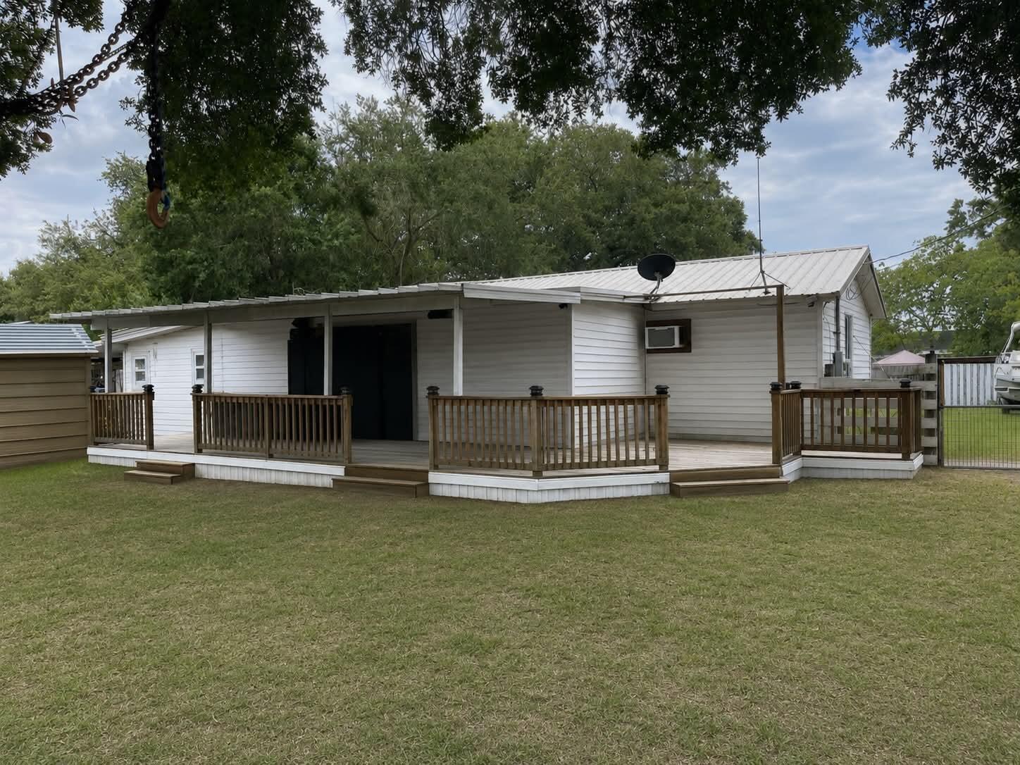 Welcome home to this charming 3-bedroom, 2-bath residence featuring a functional floor plan and desirable outdoor space. Highlights include a tankless water heater, metal roof approximately 10 years old per seller, central A/C, and a hidden closet safe room. The oversized backyard offers endless possibilities with plenty of room for entertaining, recreation, or a future pool. Whether you're looking for your next home or an investment opportunity, this property is one you won't want to miss. Schedule your showing today! Virtual Staging Disclaimer: "Some photographs have been virtually staged to illustrate the property's potential. Furnishings, décor, and other items shown in virtually staged images are for illustrative purposes only and may not be included with the sale of the property."