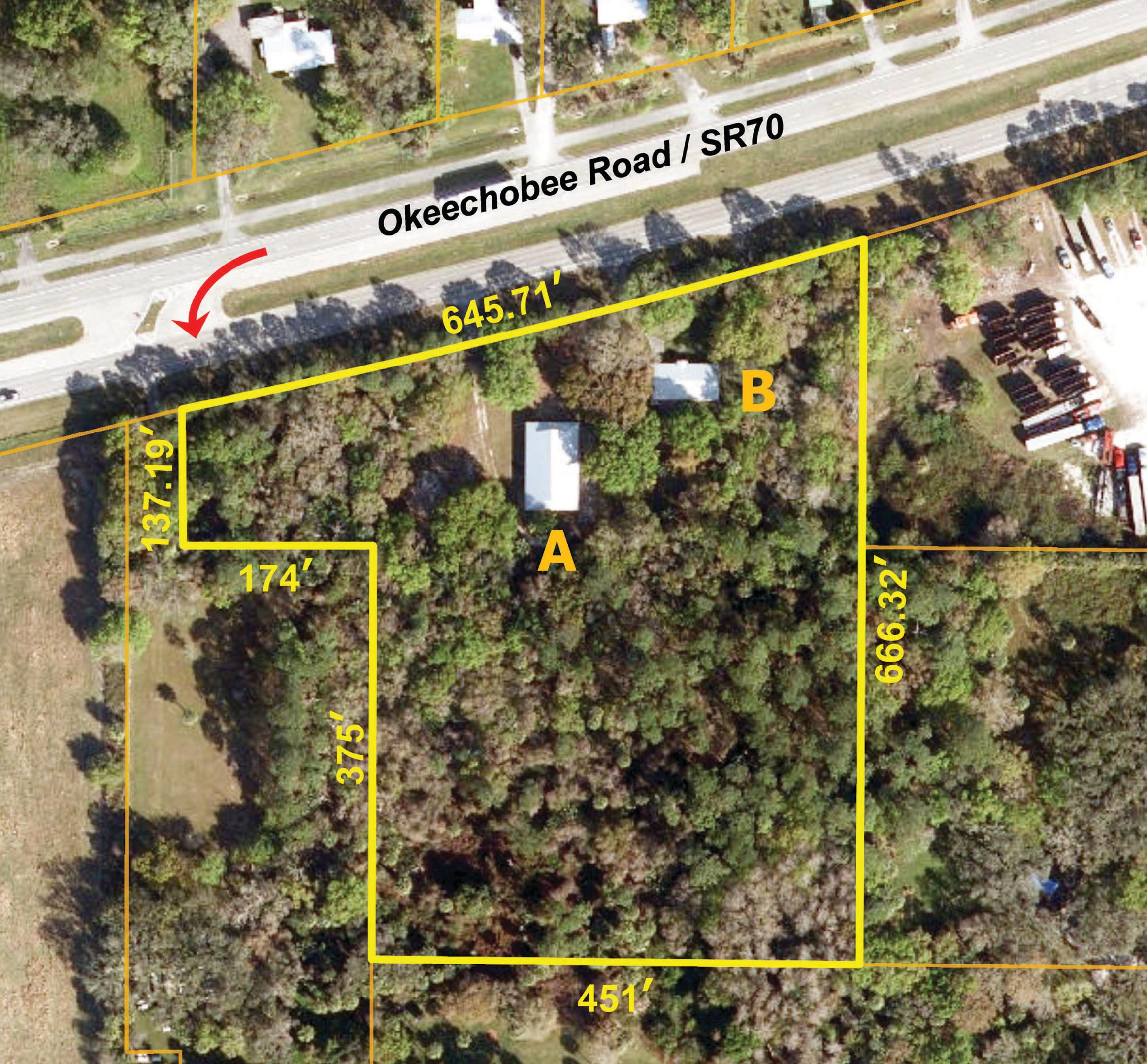 Home or Office plus versatile Shop building on wooded acreage. Mid-century CBS 3BR home with beautiful wood floors and large deck overlooking shaded yard of virgin oaks and pines. 3,344sf CBS Shop has four 18ft wide X 10ft high roll doors and 2,000sf concrete apron. Both have metal roofs. 3 driveways onto SR70 provide quick easy access to both I-95 & Turnpike. ~ Please see our BROCHURE for additional details ~