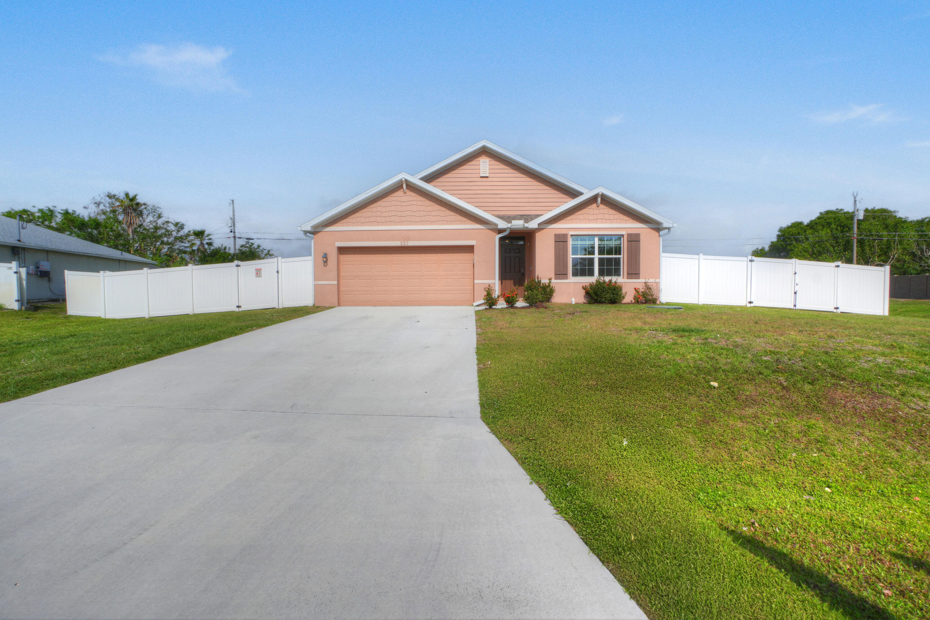 I am adorable and affordable, and NO HOA. This is the extended Cali model with a large, open, easy-to-entertain floor plan. The kitchen boasts 36" cabinets and stainless steel appliances. The kitchen also offers an island and a walk-in pantry. The primary bedroom is spacious and has an oversized walk-in closet.  There is an inside laundry area. The main living area is all easy-care neutral tile. The home has the added benefit of hurricane shutter protection. Look at the size of the fenced-in yard! This is big enough to add a pool and some! Take a look before this one is gone!