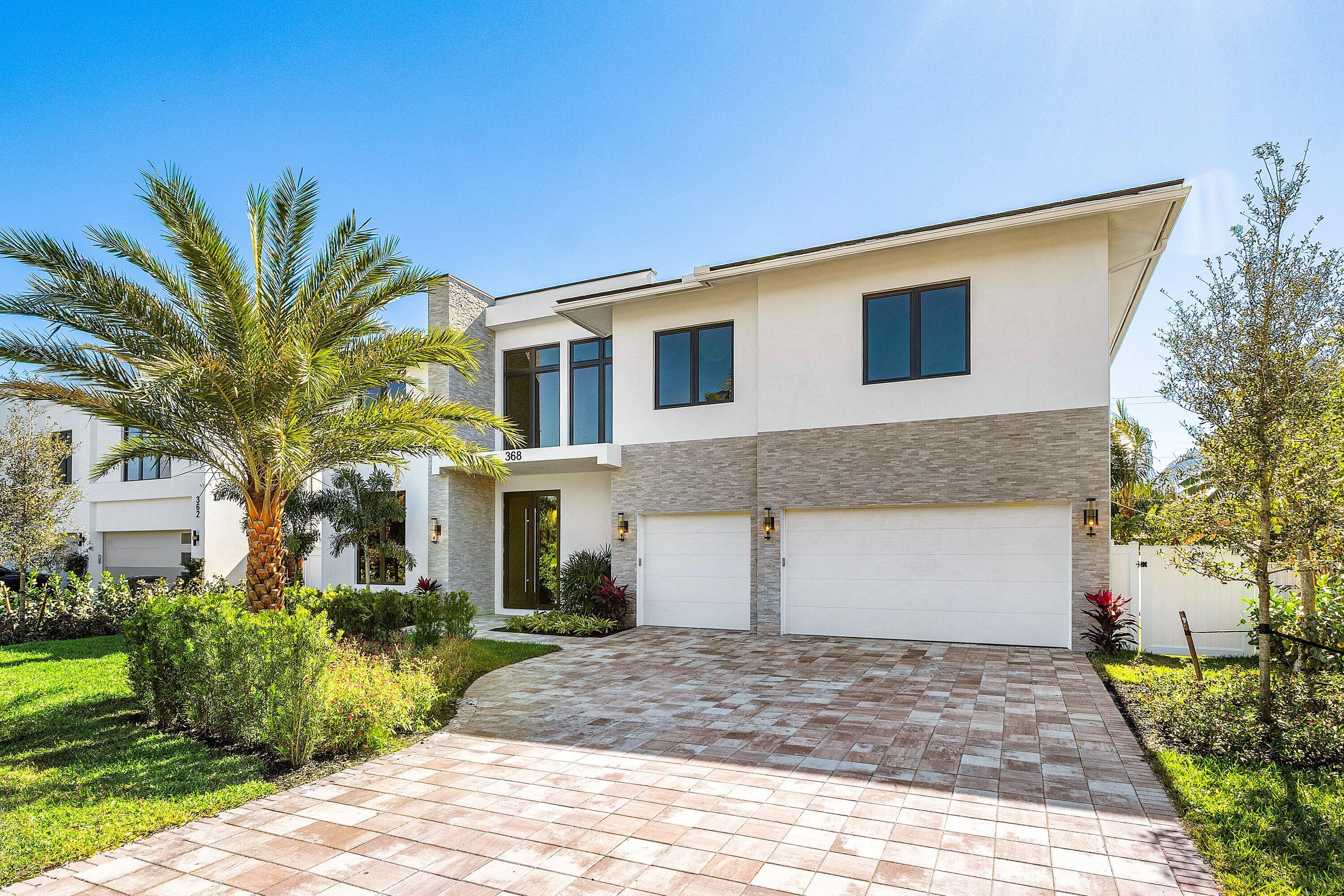 The Best of ''SoSo'' Living.
This exceptional five-bedroom estate is ideally positioned just minutes from West Palm Beach's most sought-after dining, shopping, and waterfront destinations. Thoughtfully designed with an open, light-filled floor plan, the home offers five generously sized ensuite bedrooms plus a dedicated office, blending sophistication with everyday comfort.
At the heart of the home, the gourmet chef's kitchen is both striking and functional, appointed with professional-grade Wolf and Sub-Zero appliances, sleek Taj Mahal quartzite, a fully built-out walk-in pantry with secondary refrigerator, and a spacious mudroom complete with laundry—perfectly tailored for modern living. The main level features a private ensuite bedroom with direct outdoor access, ideal for guests, along with a large office or study designed for quiet productivity or easily converted to the perfect gym or media room. Upstairs, four additional bedrooms await, including an impressive primary suite offering expansive his-and-hers closets and a spa-like retreat. A generous media loft provides flexible space for relaxation or entertainment.
Outdoors, enjoy a heated saltwater pool designed for year-round enjoyment, complete with spa, and artificial turf for a low maintenance lifestyle.  The home features a 3 car garage with epoxy finish, and is finished with impact windows and doors and a curated selection of high-end materials throughout delivering both elegance and peace of mind. Elevator ready.
A rare opportunity to experience refined luxury in one of West Palm Beach's most desirable neighborhoods.