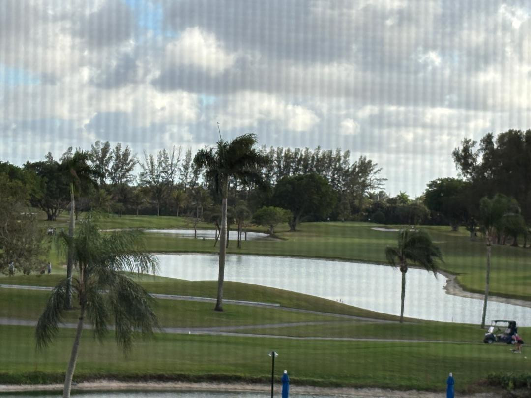 This charming condo offers a peaceful, elevated life style with sweeping views of the lakes, the sparkling pool  and the renowned PGA Championship Golf course. Residents enjoy paying no green fees just paying for cart and also enjoy another 18 hole Par 3 course. Located in a beautifully maintained adult resort like community Hollybrook provides peace of mind with a 24 hour guard at gate, a restaurant on site, tennis, pickleball, active club house and many other amenities. This unit is highly upgraded and may be offered furnished.  As per the association, one person must at least be 55 and all others 18. Income must to be at least $84,800 shown on tax returns for each of last 2 years OR have a $250,000 net worth and have at least 700 FICO credit score. Oh! Bring your pet up to 20 lbs. RLP