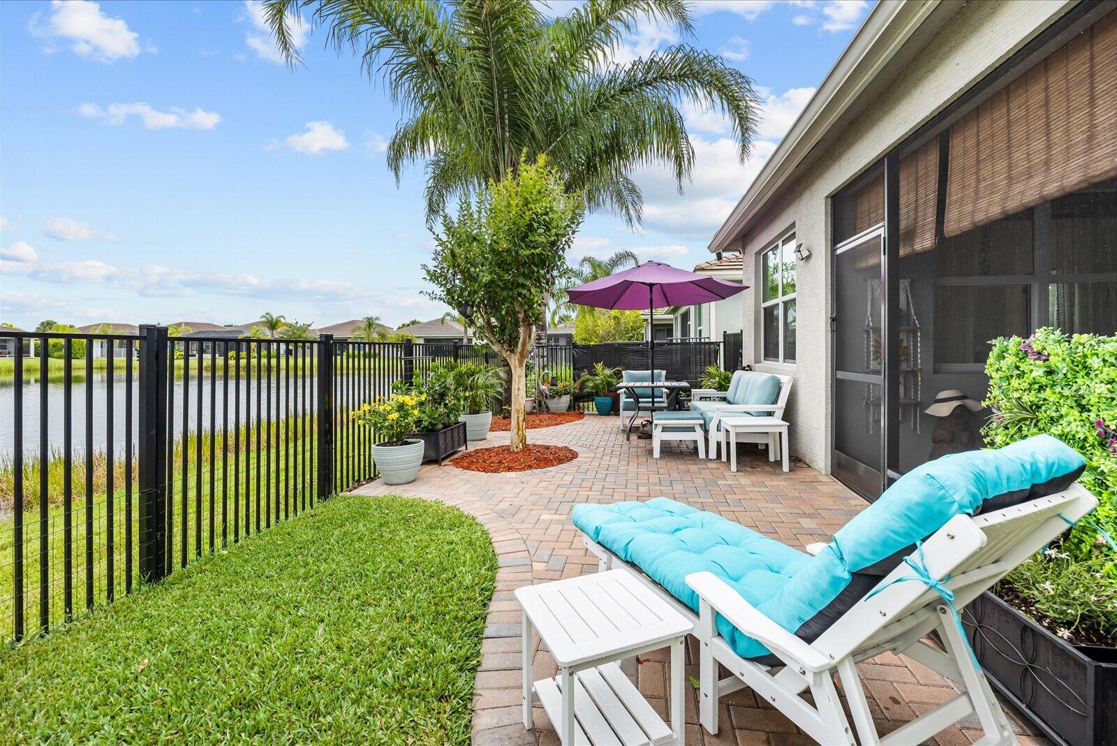 Stunning lakefront Osprey model in Valencia Cay at Riverland with $100K+ in custom upgrades! Enjoy breathtaking water views & designer finishes throughout. Refreshed kitchen boasts new SS appliances, quartz counters & custom backsplash. Living area features a custom fireplace with built-in bookcases. Renovated primary suite offers a spa-inspired bath & peaceful lake views. Highlights include designer lighting, custom accent walls, fresh paint & a rare permanently installed attic ladder for extra storage. Relax on the extended screened lanai overlooking picturesque water. Resort-style 55+ amenities include pools, fitness center, pickleball/tennis, dining, arts center & active lifestyle. Skip the build time—move in today! Over $100,000 in upgrades Premium waterfront homesite All new stainless-steel kitchen appliances Renovated primary bathroom Custom built-in bookcases and electric fireplace Quartz countertops and designer backsplash Designer lighting, fixtures, and ceiling fans Custom accent walls and architectural trim Extended screened lanai Professionally landscaped backyard Installed attic ladder with additional storage access