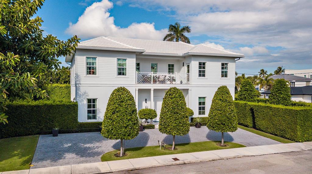Superb, move-in ready British West Indies style residence offers 5 Bedrooms + Den/Library, 4 Full Baths and Two ½ Baths (4945 sf. +/- total). Highlights include an open floor plan, 10' high ceilings, 7'' wide White Oak hardwood floors, a gourmet kitchen with Carrara marble counter tops, Thermador appliances and Grohe fixtures. This home is situated on a large 107' x 110' corner lot and has intracoastal water views from the second floor. Outside features include a covered loggia, heated swimming pool and a great side yard with plenty of space to enjoy the outdoors. Immaculate two car garage.