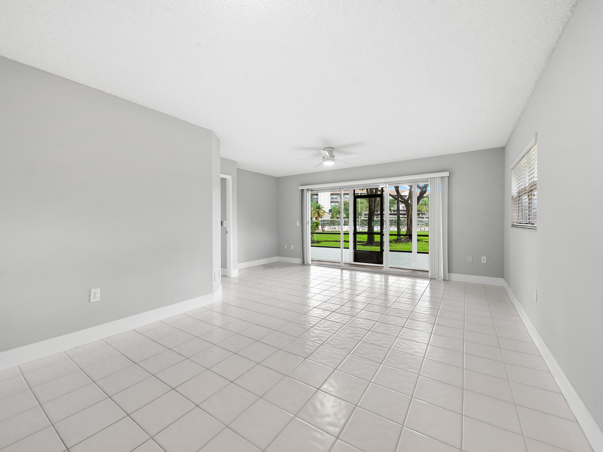Welcome to your peaceful retreat in Century Village, a vibrant 55+ community known for its resort-style living and active social scene.  This most desirable location features a 1,533 sq ft first-floor end unit nestled within a wide, manicured grassy area, offering privacy and a quiet, park-like feel. From your back door, enjoy a stunning view of the sparkling community pool beyond lush green lawn, serene, exclusive, and flooded with natural light.  Inside, you'll love the recent bathroom upgrades, modern, fresh, and move-in ready. Thoughtful and easy low-maintenance living, this 2-bedroom, 2-bath home is designed for comfort with ample personal and guest parking adds everyday ease.  Live the lifestyle: step outside to a famous clubhouse featuring a theater, gyms, tennis courts, an 18-hole  Schedule on ShowingTime, easy to show - First Service Residential, 13460 SW 10 St Suite 101 Pembroke Pines, FL, application take 30 - 45 days or the online, which will take half the time we recommend the online HOA requires min of 690 credit score.