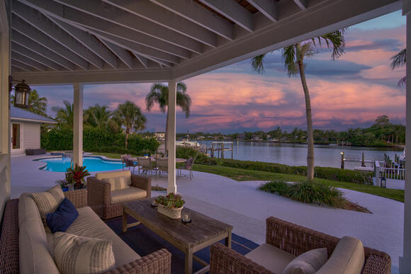 SPRAWLING PROPERTY ON THE HIGHLY SOUGHT-AFTER LOXAHATCHEE RIVER.  THIS 4400 SF GATED OASIS IS LOCATED ON NEARLY AN ACRE PARCEL.  THE 4BR/3.5 BA HOME IS EQUIPPED WITH ALL OF THE MODERN CONVENIENCES. WITH A CHEF'S KITCHEN PERFECT FOR BOTH COOKING AND ENTERTAINING,IT INCLUDES A SUB ZERO REFRIGERATOR AND WOLF APPLIANCES THROUGHOUT, A CUSTOMIZED BUILT-IN WET BAR, QUARTZ COUNTERTOPS AND A LARGE COUNTER-HEIGHT ISLAND TO EASILY PREP AND SERVE  MEALS WITHOUT MISSING OUT ON THE FUN.
THIS HOME HAS AN INVITING FLOOR PLAN WITH 20FT VAULTED CEILINGS AND EXPANSIVE ENTERTAINING SPACES EACH WITH VIEWS OF THE RIVER. EXTERIOR FEATURES INCLUDE A UNIQUELY DEEP LOT PERFECT FOR A GUEST HOUSE/OFFICE, LUSH LANDSCAPING, PUTTING GREEN W/BUNKER AND DOCKSIDE FIRE TABLE,
THE 2-CAR GARAGE COMES WITH TESLA CHARGER.