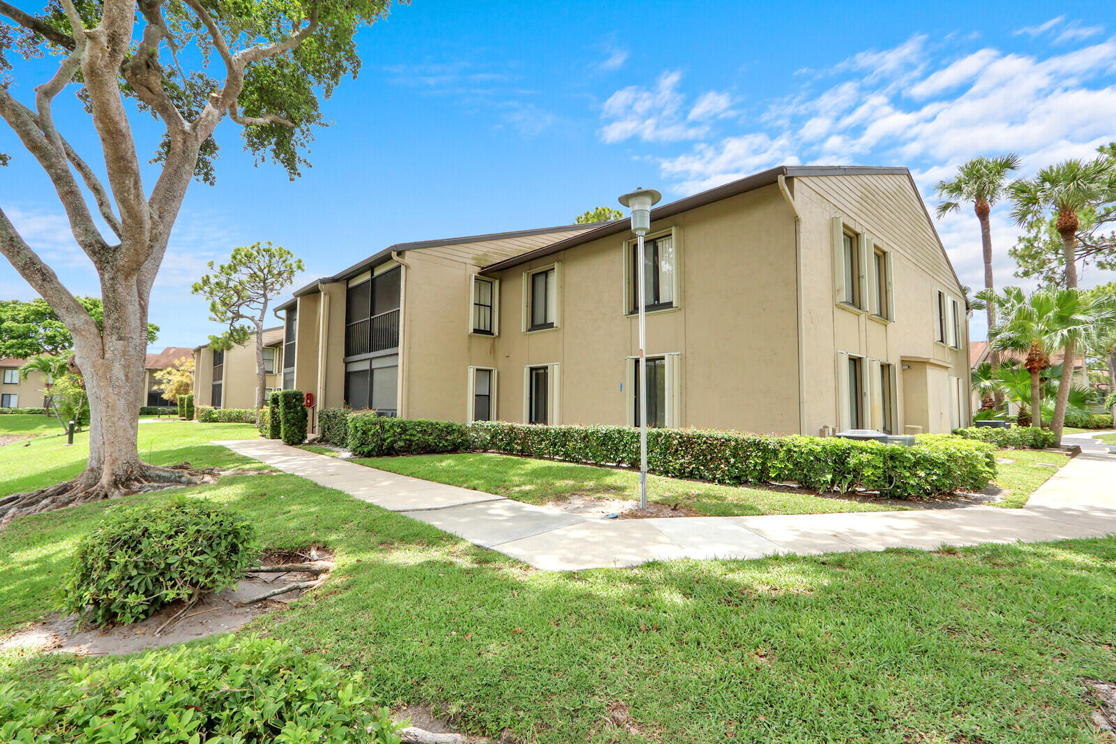 Welcome to this waterfront condominium located in Pine Ridge North Village III in Greenacres. All ages welcome. This three-bedroom, two-bathroom spacious residence on the first floor, offers new flooring and paint through out. Close to pool and clubhouse. Great location. Near fire and police stations. Move in ready!