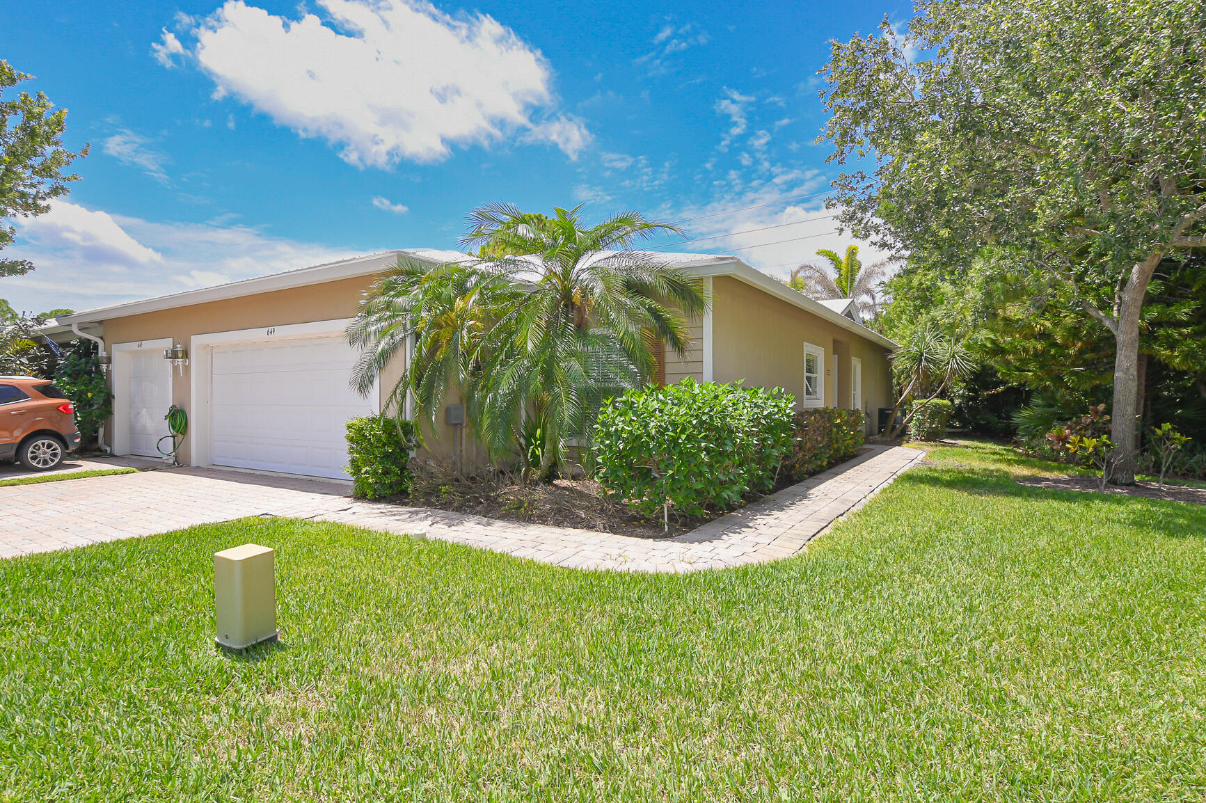 Gorgeous 2 bedroom, 2 bath, 2 car garage end villa with 2023 Metal Roof and Impact windows and sliding glass door.  Freshly painted and new LVP flooring.  Split floor plan with an office/den area.