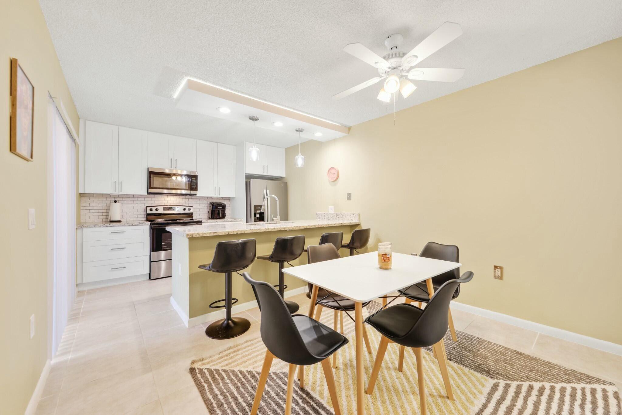 Located in the Village of Sandalwood Lakes South , this newly renovated 2-bedroom, 2.5-bath townhome offers the perfect combination of style, comfort, and convenience. The bright, modern interior features a spacious kitchen with stainless-steel appliances, granite countertops, brand new full-size washer and dryer and brand new ac 2025. Upstairs, two master bedrooms each include ensuite bathrooms and private balconies with tranquil views. The home also features new flooring, updated bathrooms, fresh paint, and accordion hurricane shutters for added security. Step outside to a large, private, fenced-in front patio, perfect for enjoying outdoor living.  Community amenities include three pools, picnic areas, playgrounds, tennis courts, and more. Located in the Village of Sandalwood Lakes South , this newly renovated 2-bedroom, 2.5-bath townhome offers the perfect combination of style, comfort, and convenience. The bright, modern interior features a spacious kitchen with stainless-steel appliances, granite countertops, brand new full-size washer and dryer and brand new ac 2025. Upstairs, two master bedrooms each include ensuite bathrooms and private balconies with tranquil views. The home also features new flooring, updated bathrooms, fresh paint, and accordion hurricane shutters for added security. Step outside to a large, private, fenced-in front patio, perfect for enjoying outdoor living.  With easy access to I-95, downtown West Palm Beach, Rosemary Square, and the area's top beaches, shopping, and dining, this home truly offers it all. Schedule your showing today!