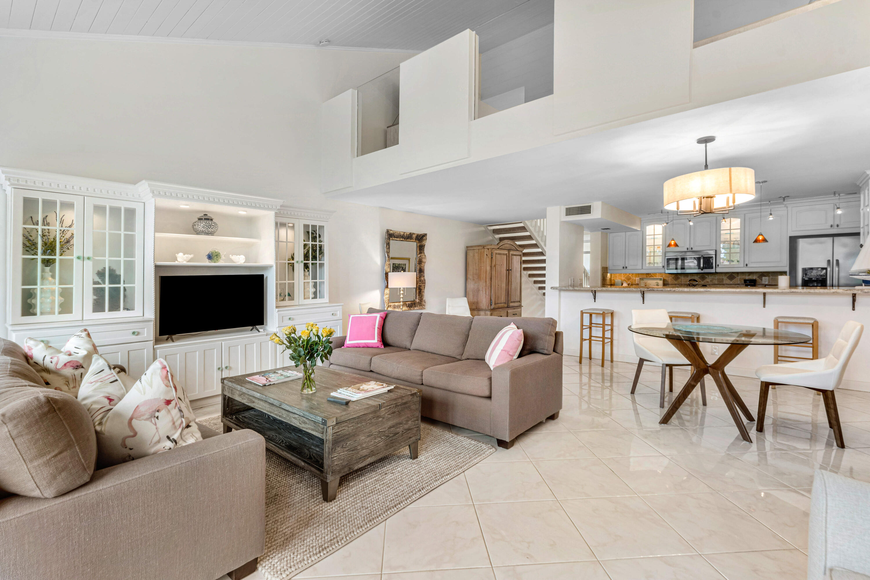 Just steps from PGA National Resort and situated on the worldfamous Fazio Course inside PGA national, this lightfilled townhome features dramatic 16-18' ceilings and panoramic windows overlooking the 10th hole. The beautiful barstyle kitchen showcases glassfront cabinetry and neutral finishes. Enjoy an airy, tropical second floor primary suite with an updated shower and spacious walk in closet. Additionally, there is a garage and very private patio. A serene front oasis with breathtaking south and westfacing sunset views. ESTABLISHED rental income!  Mins to turnpike or i95.