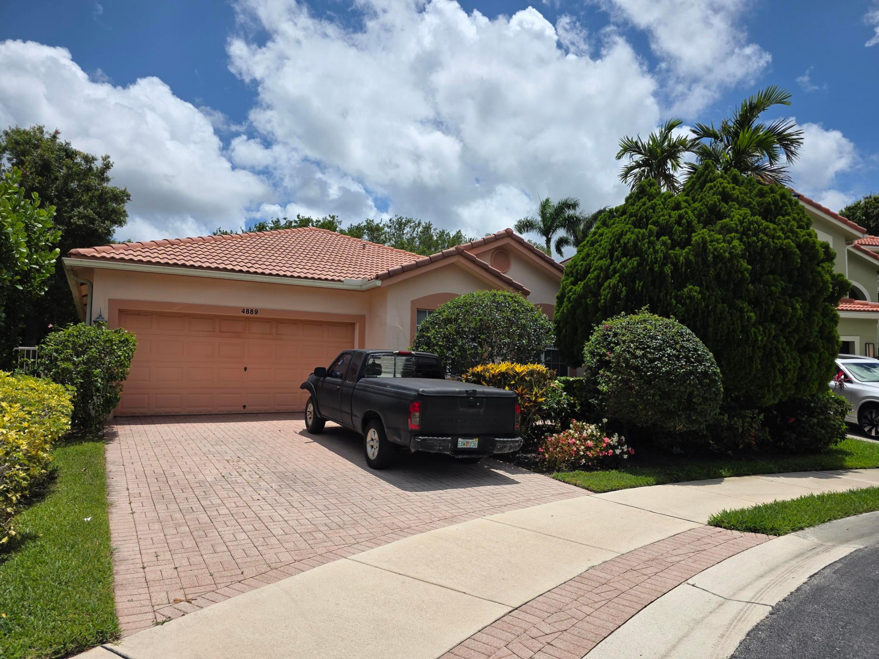 Welcome to The Colony at Delray Beach — a gated community with resort-style amenities including a clubhouse, fitness center, lakeside pool with sundeck & cabanas, basketball court, and playground. This elegant 3BD/2.5BA + flex room Mediterranean home with 2-car garage checks every box. Soaring vaulted ceilings, arched doorways, and large-format tile flow through an open layout. The chef's kitchen features granite countertops and a center island opening to the family room. A formal dining room with dramatic iron chandelier impresses every guest. The private pool oasis and lush tropical landscaping make outdoor living effortless. Minutes from Delray's world-famous Atlantic Ave, dining, boutiques, and pristine beaches. Furniture negotiable. Live the South Florida lifestyle you deserve!