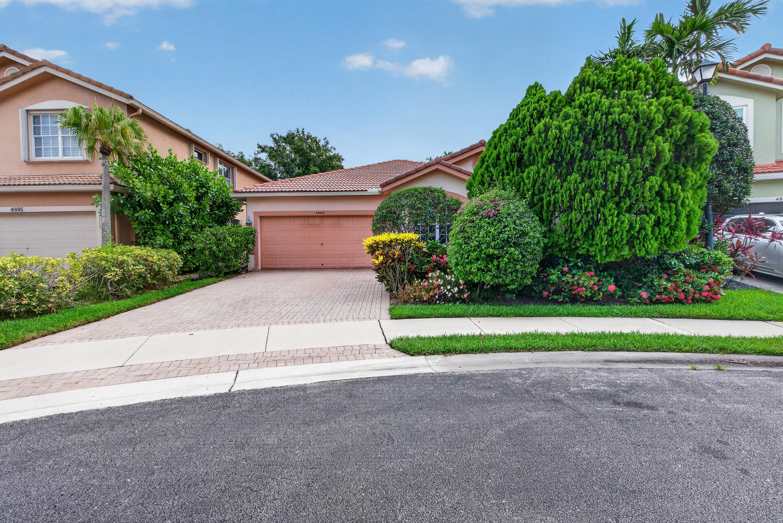 Welcome to The Colony at Delray Beach — a gated community with resort-style amenities including a clubhouse, fitness center, lakeside pool with sundeck & cabanas, basketball court, and playground. This elegant 3BD/2.5BA + flex room Mediterranean home with 2-car garage checks every box. Soaring vaulted ceilings, arched doorways, and large-format tile flow through an open layout. The chef's kitchen features granite countertops and a center island opening to the family room. A formal dining room with dramatic iron chandelier impresses every guest. The private pool oasis and lush tropical landscaping make outdoor living effortless. Minutes from Delray's world-famous Atlantic Ave, dining, boutiques, and pristine beaches. Furniture negotiable. Live the South Florida lifestyle you deserve!
