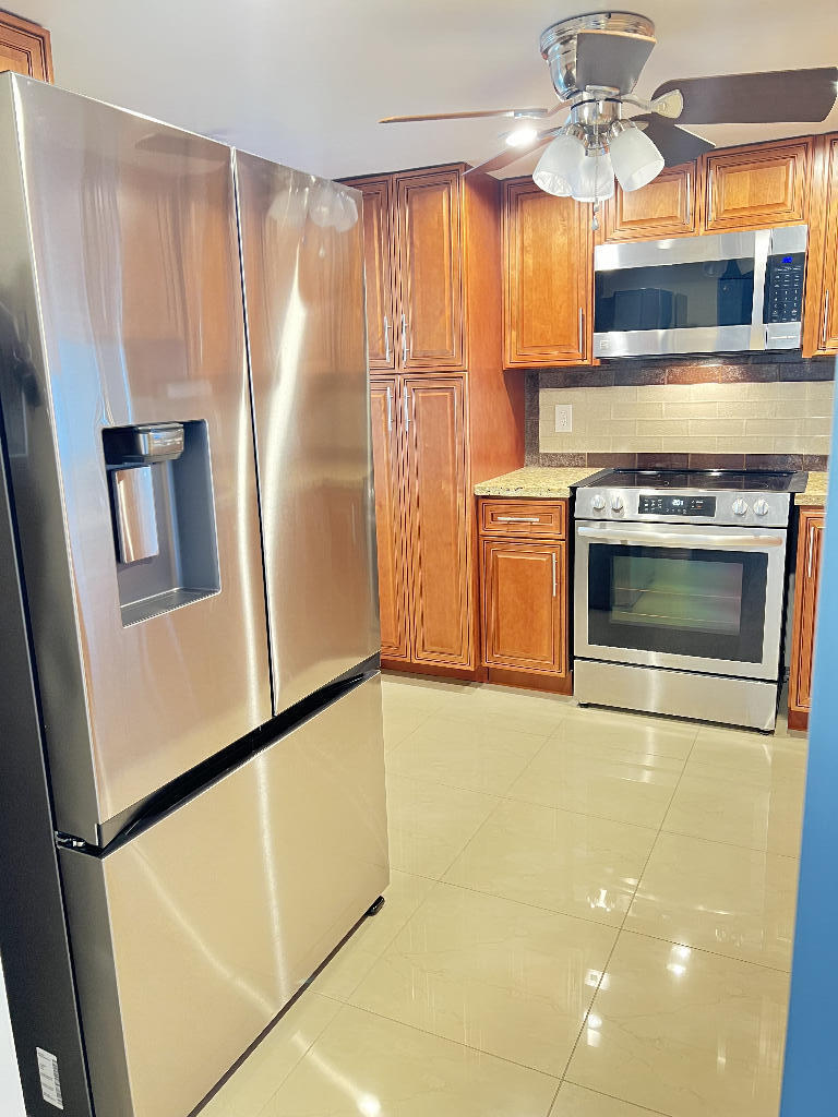 Professionally appraised you can take to the bank. Walk or ride bicycle to beach, 2/2 lake view with lots of wildlife, cat5 hurricane impact windows with insulation ($30k value) association will be required to get everyone to install hurricane impact windows but you won't have to pay for that, 40 year recertification completed and all assessments paid, walk-in spa tub with therapy jets and therapy lights and water softener and stereo speakers ($20k value), all solid wood cabinets in kitchen and bathrooms with matching granite countertops, smooth ceilings no popcorn, all stainless steel appliances with huge 32 cf refrigerator, led lights in kitchen (this is a kitchen for those who love to cook with cabinets to spare, enclosed balcony for additional room, all new modern/custom closet doors.
