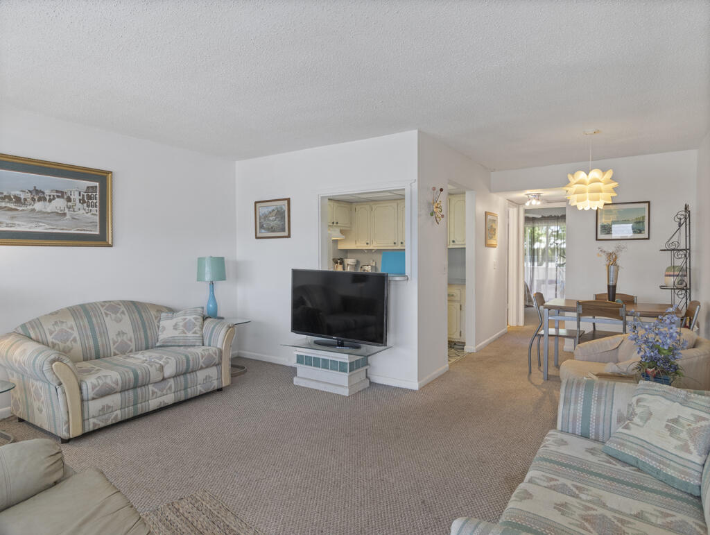 ACTIVE 55+ COMMUNITY! Enjoy tranquil garden views from the screened patio of this charming 1-bedroom, 1-bath second-floor condo. A wonderful opportunity to personalize and create your ideal Florida retreat. Residents enjoy an exceptional lifestyle with complimentary transportation 7 days a week, a state-of-the-art theater, fitness center, indoor and outdoor pools, tennis, pickleball, bocce, and countless amenities, clubs, and activities. Resort-style living at its best! To be sold furnished and 'as is'.
