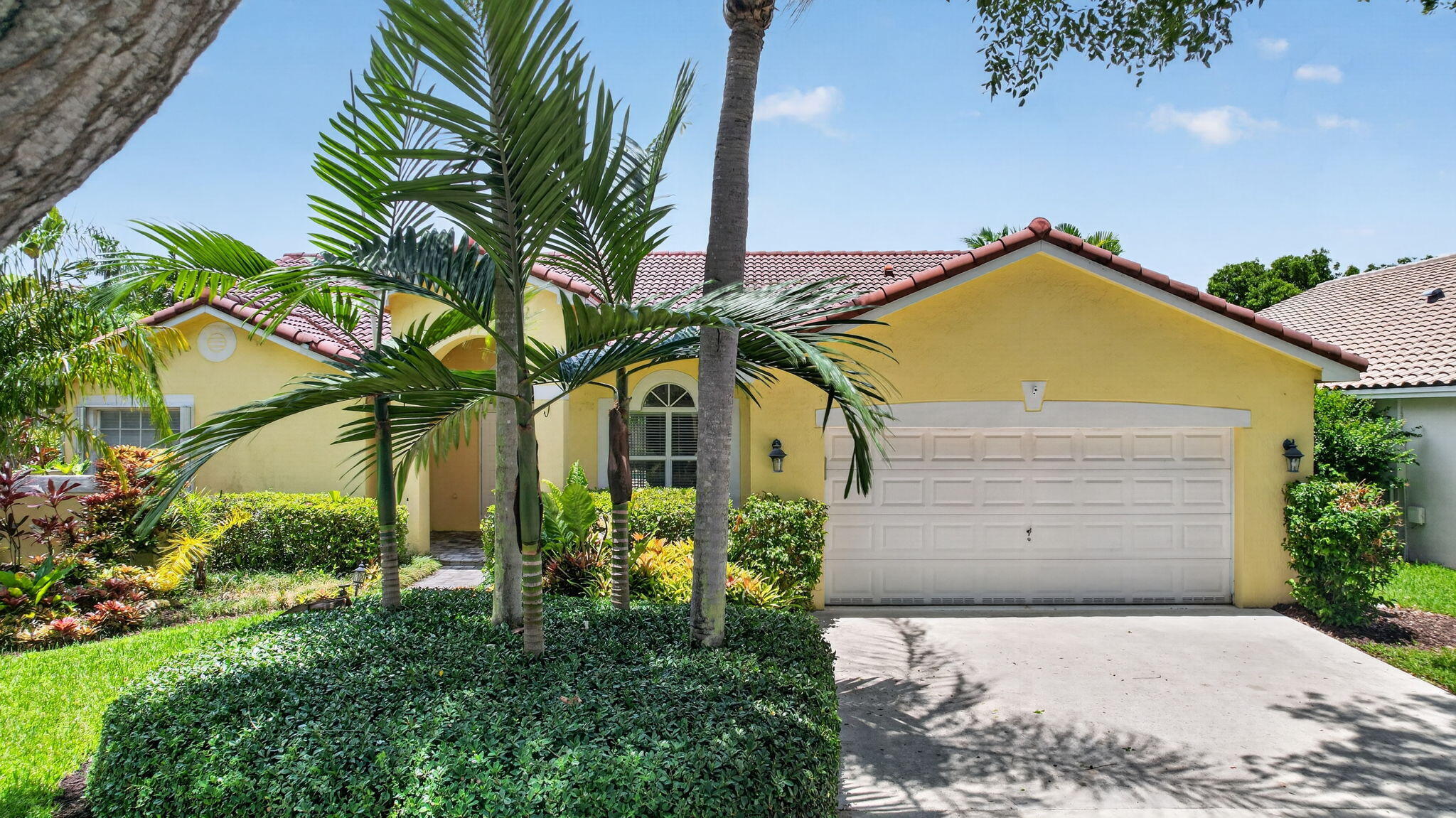 Live in one of Weston's premier gated communities, across from Town Center, in a top-rated school district! This home features a private, fenced backyard with a screened, freeform pool, covered patio & cabana bath, making poolside lounging effortless. The primary suite also offers pool access, 2 customized closets, an updated bathroom with dual vanities, separate tub, shower & WC. Enjoy an open eat-in kitchen with custom wood cabinets, granite counters & plenty of space to cook & gather. With a separate living & dining area, this home offers endless layout possibilities to suit your lifestyle. Equipped with oak & acacia floors throughout, split bedrooms, a laundry room & a 2-car garage. Don't miss the opportunity to make this exceptional Weston home yours! Also for sale B26046590.