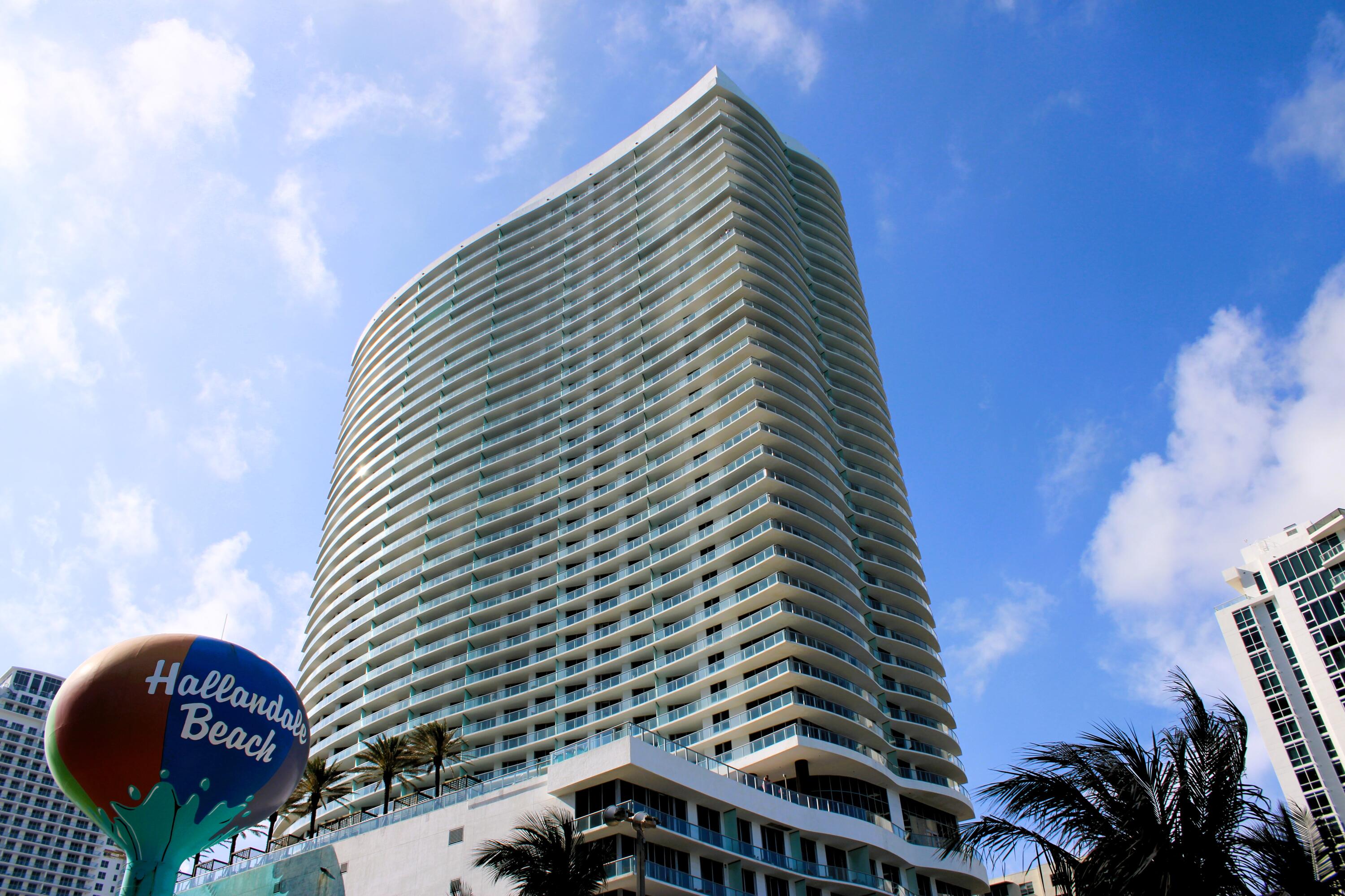 Welcome to your sky-high sanctuary at LYFE Beach Resort! This stunning fully furnished 2-bedroom, 2-bathroom condo on the 30th floor delivers breathtaking panoramic views of the Atlantic Ocean and the glittering Hollywood cityscape — from sunrise to sunset, every moment is a masterpiece. The open-concept living area flows effortlessly with natural light, showcasing sleek modern finishes and premium materials throughout. The gourmet kitchen features top-of-the-line appliances, custom cabinetry, and generous counter space — perfect for entertaining or a quiet evening in. Both bedrooms offer en-suite bathrooms for ultimate privacy, with the master suite boasting a glass-enclosed shower and unobstructed ocean views.  NO rental restrictions — an exceptional opportunity for investors or those seeking a luxury pied-à-terre with income potential. World-class amenities include an infinity pool overlooking the Atlantic, two restaurants, a full-service spa, fitness center, sun deck with private cabanas, business center, and 24/7 doorman and lobby security. Everything is included — just bring your swimsuit. Live the resort life every day.