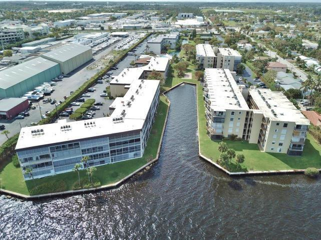 REDUCED! WATER VIEWS! WAKE UP AND BE STEPS FROM THE WATER! WELL MAINTAINED TWO BEDROOM /TWO BATHROOM SPACIOUS CONDO WITH NEW APPLIANCES OFFERS A CHANCE TO LIVE RIGHT ON THE INTRACOASTAL! GROUND FLOOR UNIT WITH ENCLOSED PATIO & WATER VIEWS! GREAT OPPORTUNITY FOR A BUYER TO ADD THEIR OWN FINISHING TOUCHES AND UPGRADES.  HIDDEN HARBOUR IS GATED INTRACOASTAL COMMUNITY OFFERING  GORGEOUS POOL, SAUNA, TENNIS, EXERCISE ROOM, CLUBHOUSE/ SOCIAL ROOM WITH FULL KITCHEN. SMALL PET ALLOWED UNDER 30 LBS.  CONVENIENT LOCATION CLOSE TO BEACHES, DOWNTOWN LAKE WORTH OR LANTANA AND I-95. WASHER AND DRYER IN THE UNIT. EXTRA STORAGE.