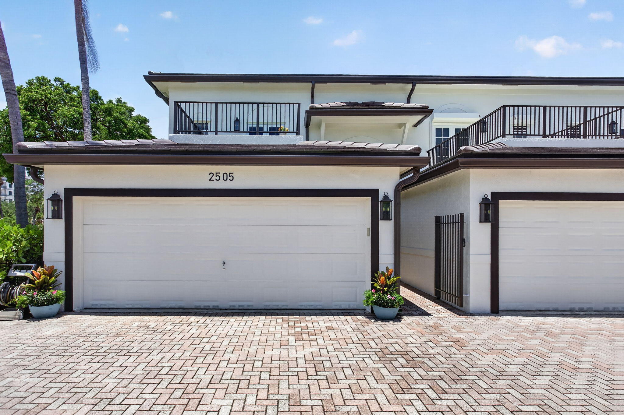Some homes check boxes. Others change expectations. Welcome to 2505 NE 2nd Street, a thoughtfully renovated coastal residence that delivers the space, privacy, and livability many buyers seek in a single-family home—without the upkeep that often comes with it. Tucked within an intimate five-residence community in one of Pompano Beach's most walkable neighborhoods, this end-unit home offers approximately 2,200 square feet of beautifully designed living space, enhanced by soaring ceilings, abundant natural light, and water views from the primary suite and private terrace. At the heart of the home is a custom-designed kitchen renovated in 2023, featuring ceiling-height cabinetry, quartz countertops, an oversized island, beverage station, and designer finishes throughout.  A dedicated office, custom built-ins, walk-in closets, and integrated smart-home technology create a seamless environment for both work and everyday living. Outside, a private tropical backyard provides a peaceful setting for morning coffee, weekend gatherings, gardening, or evening dining under the stars. Recent improvements, including a new tile roof, exterior enhancements, HVAC system, and water heater, offer added peace of mind. Just moments from waterfront dining, the beach, the pier, parks, fitness studios, coffee shops, and everyday conveniences, this move-in-ready residence offers a rare opportunity to enjoy a connected coastal lifestyle with exceptional comfort and ease. Experience the perfect balance of location, design, and low-maintenance living at 2505 NE 2nd Street.