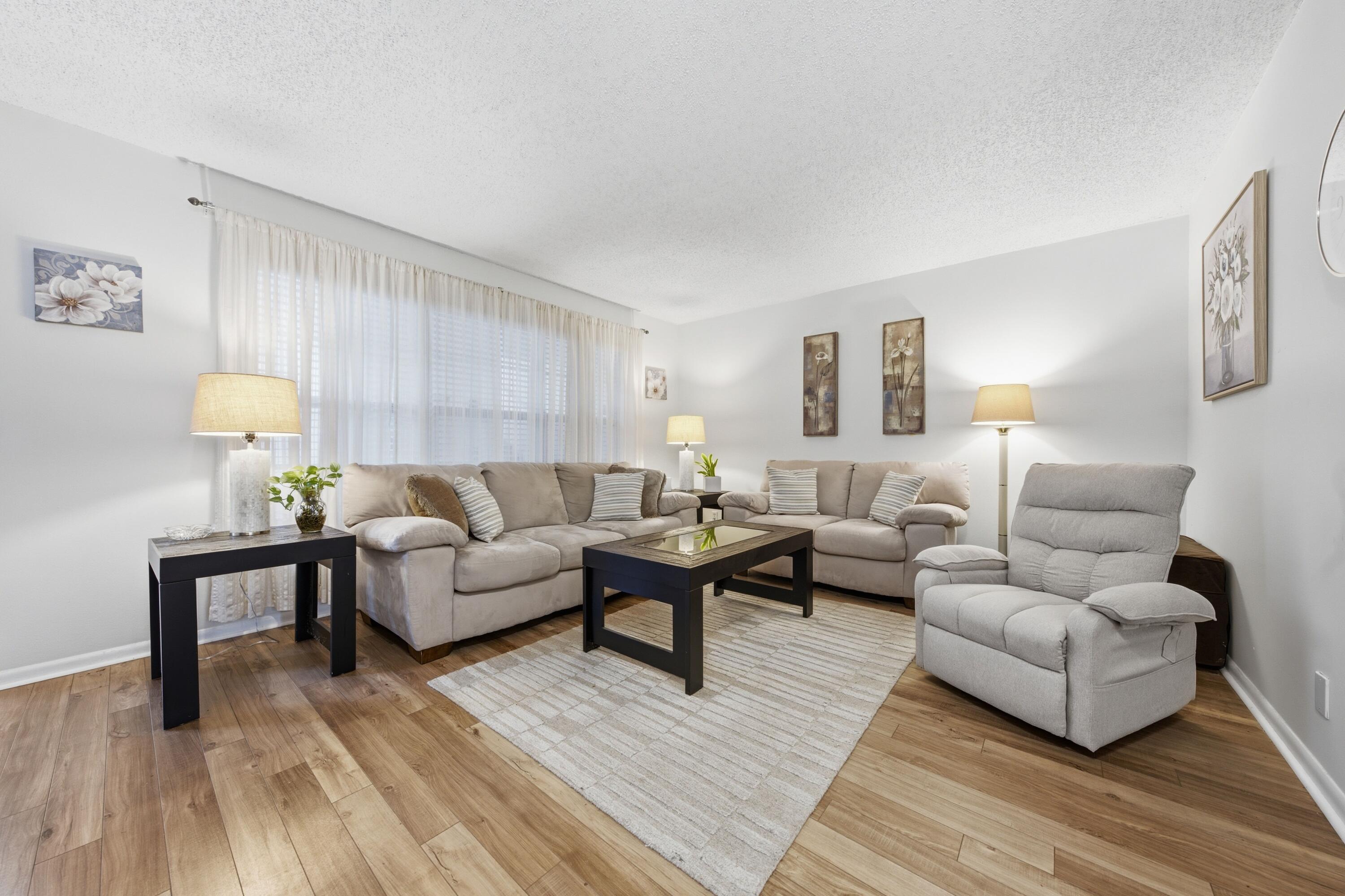 Beautifully updated and fully furnished ground-floor 1BR/1.5BA condo in the sought-after Greenbrier community of Century Village (55+). Freshly cleaned and beautifully presented, this bright, move-in-ready home offers 842 sq. ft. under air (912 total sq. ft.) and features a renovated open kitchen, modern furnishings, laminate flooring, a spacious primary suite, impact windows, and accordion shutters. Enjoy resort-style living with a private pool, 24/7 gated security, and access to Century Village's premier amenities, including a clubhouse, theater, fitness center, tennis courts, and multiple heated pools. For added convenience, there are two laundry rooms on the first floor, both free for residents to use. Ideally located just minutes from beaches, shopping, dining, and Palm Beach Intern