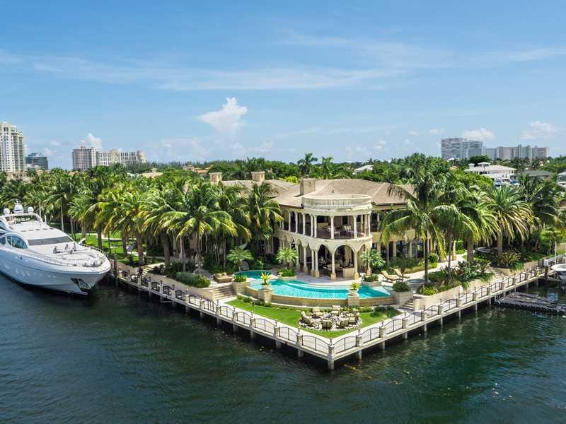 Ft. Lauderdale's premiere trophy residence is positioned on 3 lots in the exclusive guard gated Harborage Isle. Boasting wide Intracoastal & city views & 505' of mega yacht dockage. The incomparable estate offers 6BR/7.2BA/6CG & 17,037sf of total luxury.  Features & amenities incl. rotunda entry, dbl. staircase, elevator, beautiful marble, onyx & hardwood flooring, 24' windows, 5 fireplaces, wine room, bar, hm. theater, office & gym. Outside offers tennis ct., cabana, summer kit, infinity pool & motor ct.